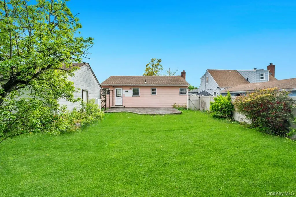 Expansive green lawn with mature trees and established landscaping Expansive green lawn with mature trees and established landscaping