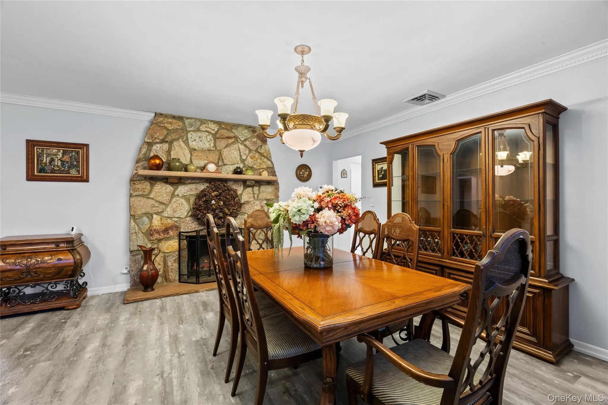 Stone-clad fireplace with mantel and hearth Stone-clad fireplace with mantel and hearth
