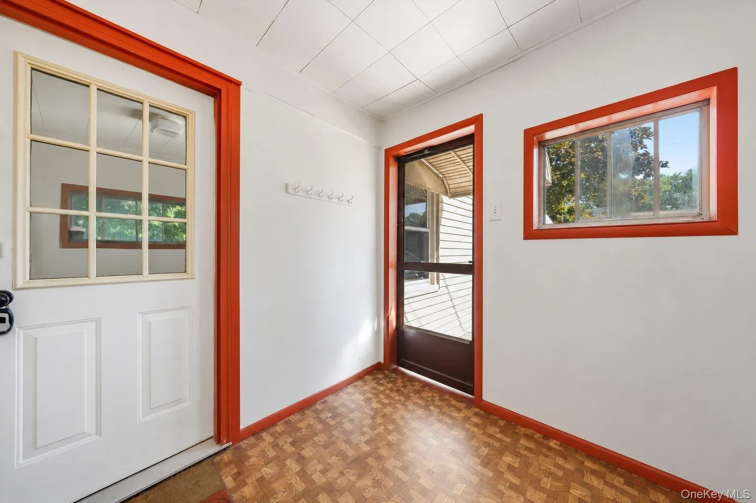 Bonus Room: Bright bonus room with built-in cabinets, mirrored storage, distinctive red trim, and flexible space for an office, craft room, or playroom. Bonus Room: Bright bonus room with built-in cabinets, mirrored storage, distinctive red trim, and flexible space for an office, craft room, or playroom.