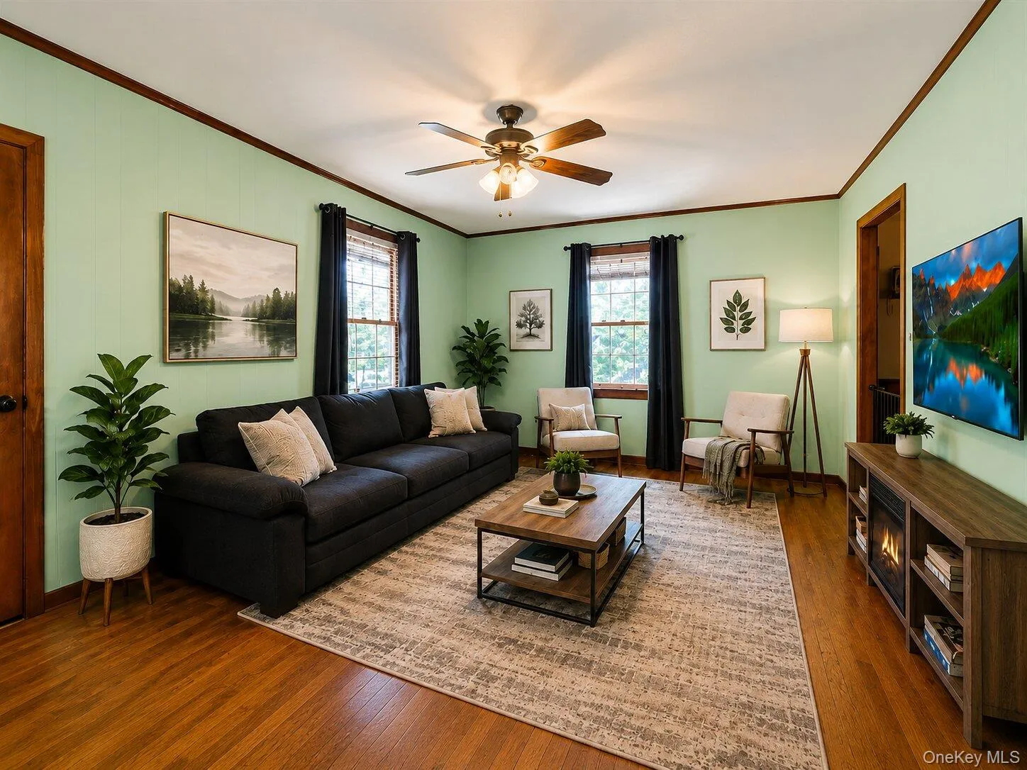 Virtually Staged: Spacious and inviting living room featuring hardwood floors, plenty of natural light, and a flexible layout with ample room for relaxing, entertaining, or spending time with family. Virtually Staged: Spacious and inviting living room featuring hardwood floors, plenty of natural light, and a flexible layout with ample room for relaxing, entertaining, or spending time with family.