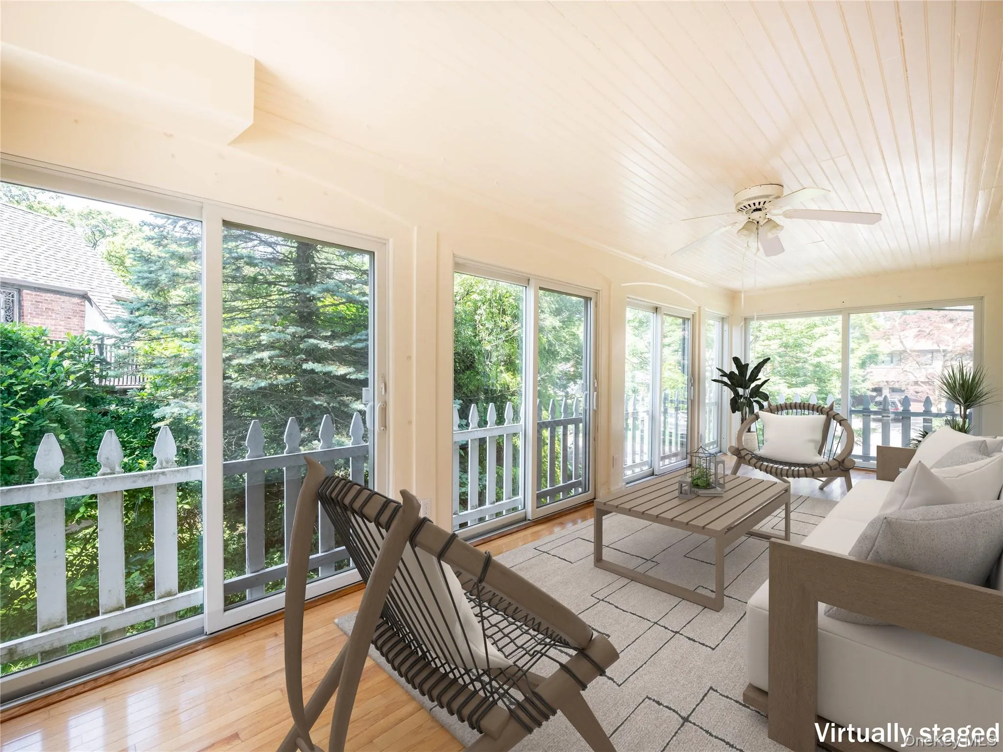 Sunroom featuring wood finished floors and wooden ceiling Sunroom featuring wood finished floors and wooden ceiling