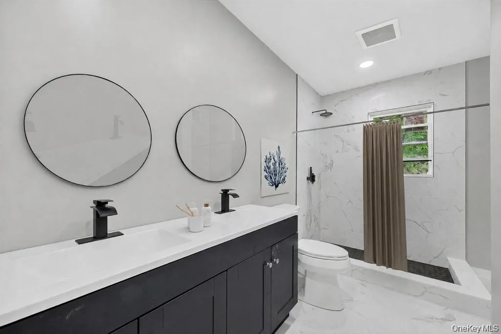 Virtually Staged. The primary bathroom provides convenience and privacy, creating a functional space designed for everyday comfort. Virtually Staged. The primary bathroom provides convenience and privacy, creating a functional space designed for everyday comfort.