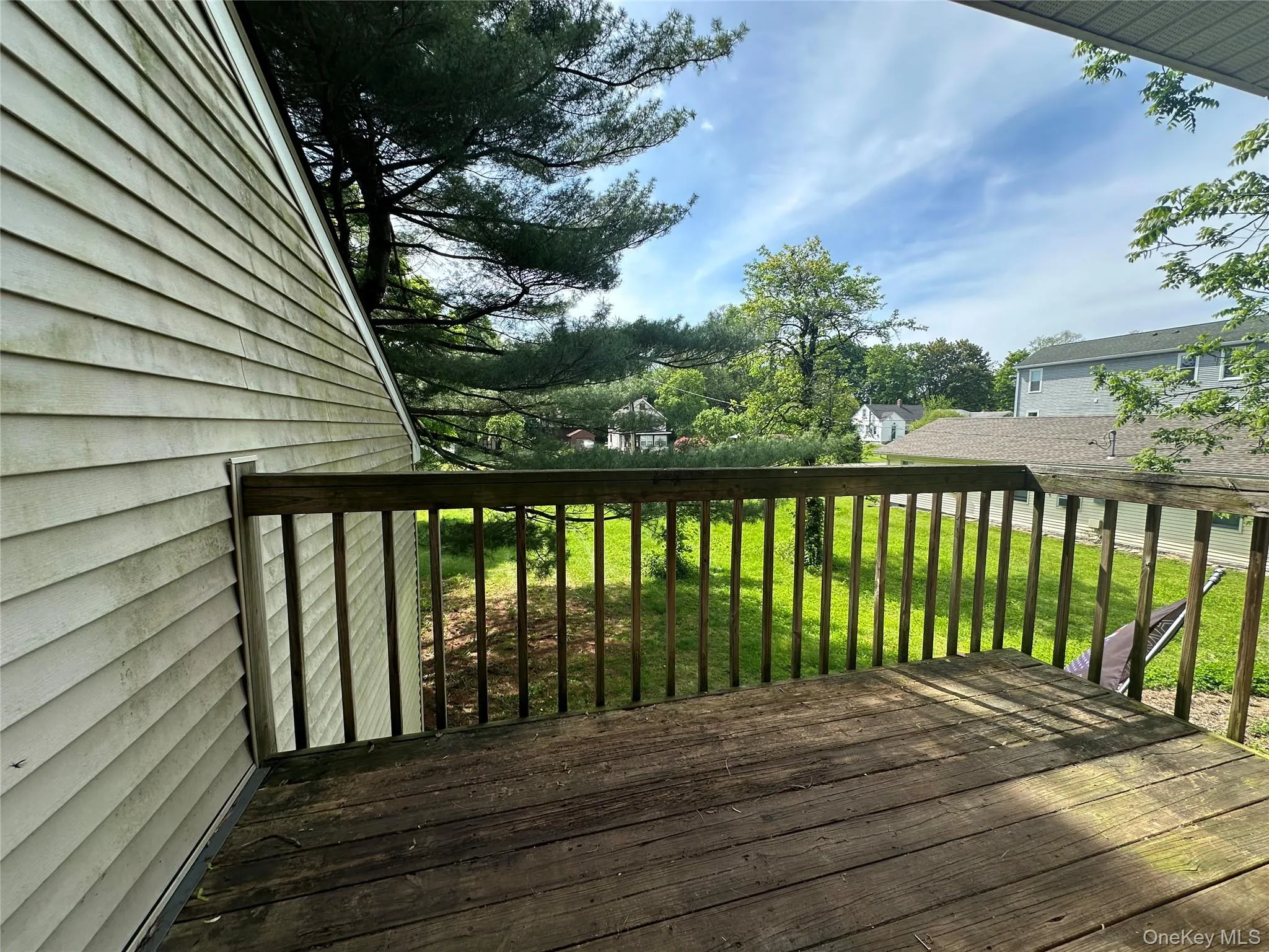 Wooden terrace featuring a yard Wooden terrace featuring a yard