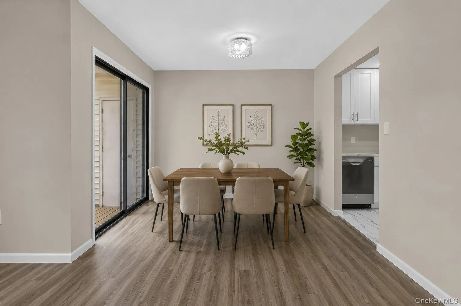 Virtually Staged Dining Area – Bright and inviting dining space featuring modern flooring, neutral finishes, and direct access to the private balcony. Virtually Staged Dining Area – Bright and inviting dining space featuring modern flooring, neutral finishes, and direct access to the private balcony.