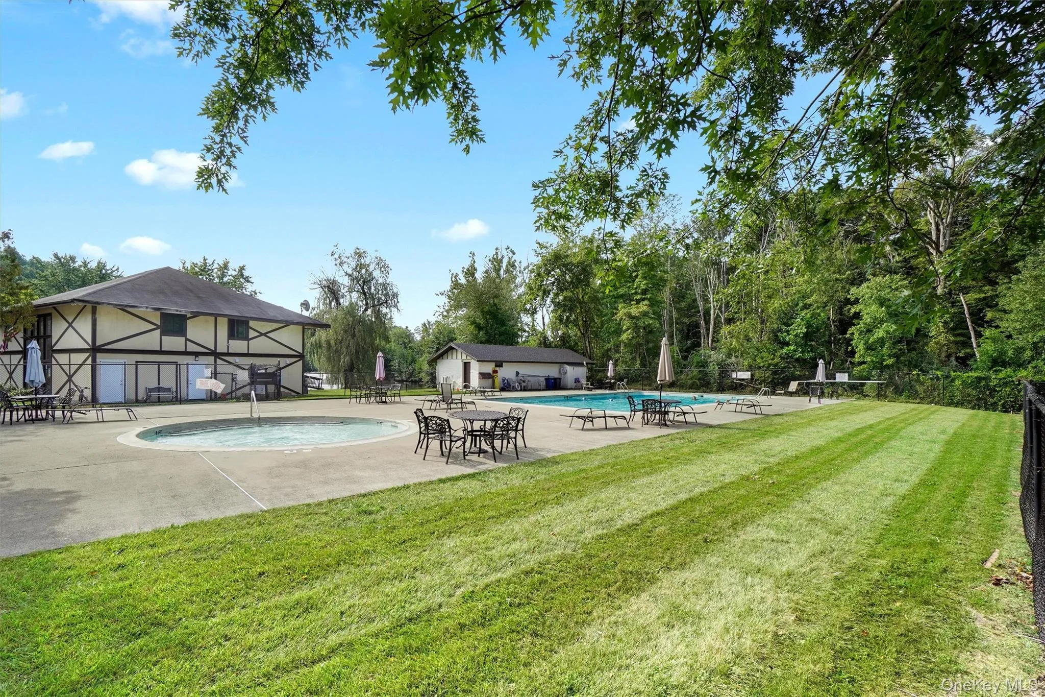 Community Swimming Pools – Enjoy a spacious pool area featuring a main swimming pool, a separate shallow pool, lounge seating, tables, and nearby playground facilities. Community Swimming Pools – Enjoy a spacious pool area featuring a main swimming pool, a separate shallow pool, lounge seating, tables, and nearby playground facilities.