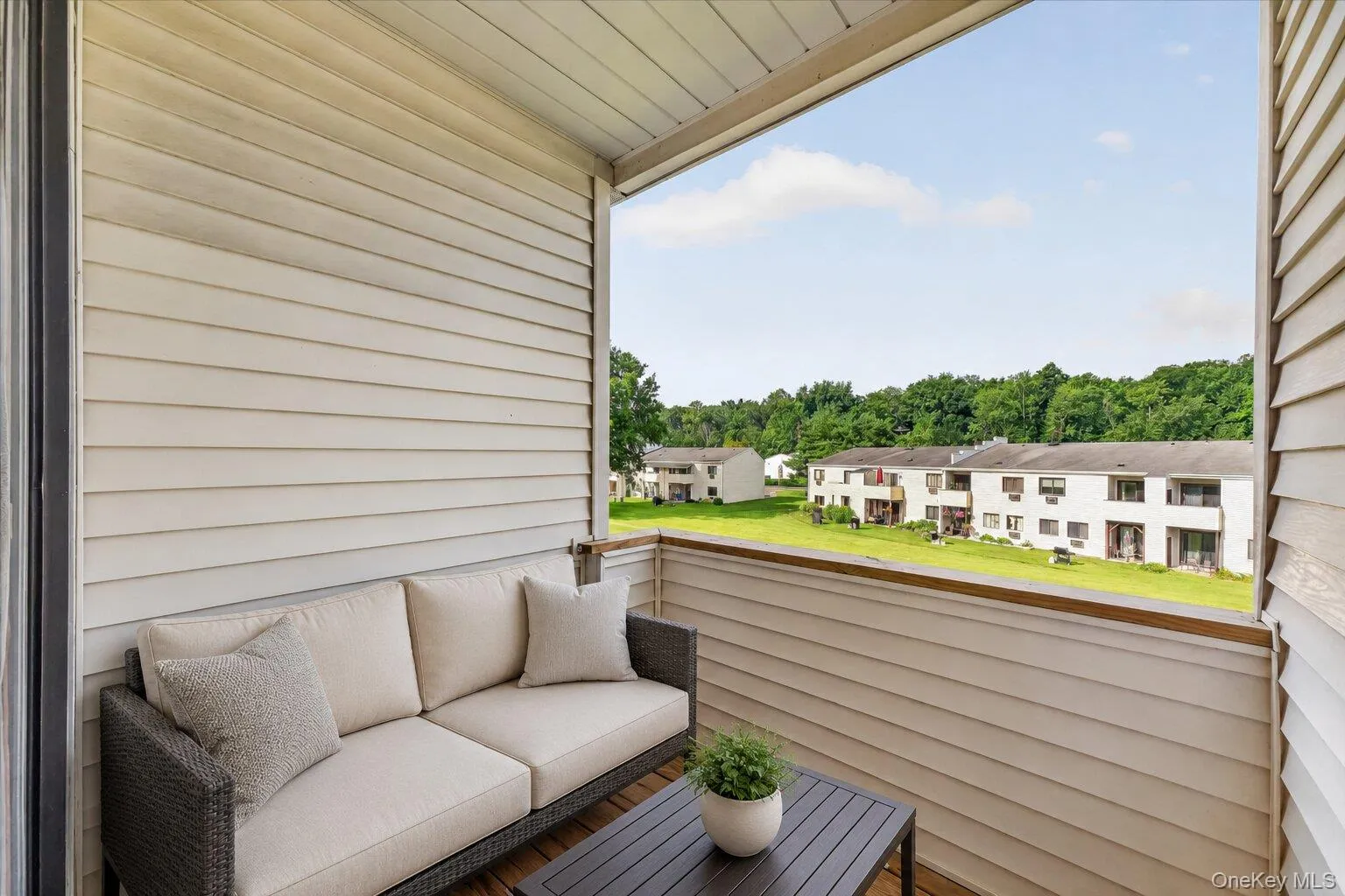 Private Covered Balcony – A peaceful outdoor retreat with room for comfortable seating and open views of the beautifully maintained community grounds. Private Covered Balcony – A peaceful outdoor retreat with room for comfortable seating and open views of the beautifully maintained community grounds.