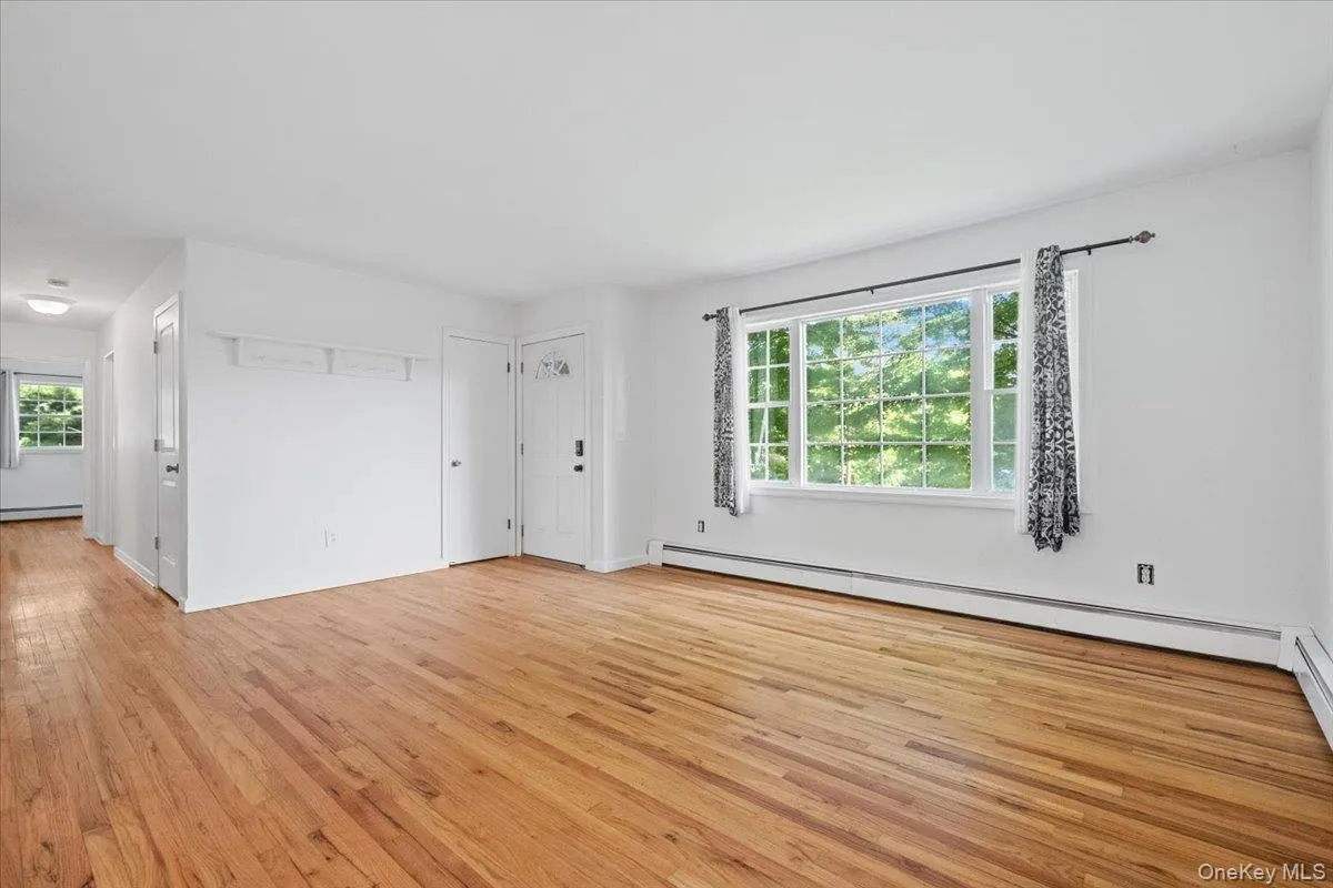 Large living room with lots of natural light. Large living room with lots of natural light.