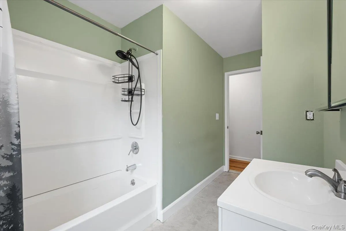 Bathroom has a linen closet Bathroom has a linen closet