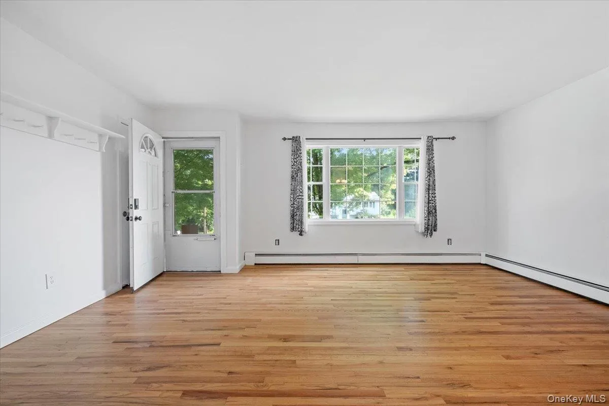 Front door and large picture window in the living room Front door and large picture window in the living room