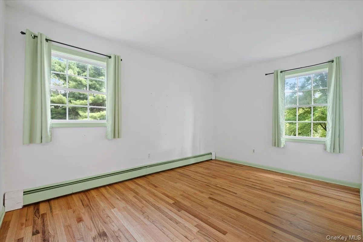Third bedroom with hardwood floors Third bedroom with hardwood floors