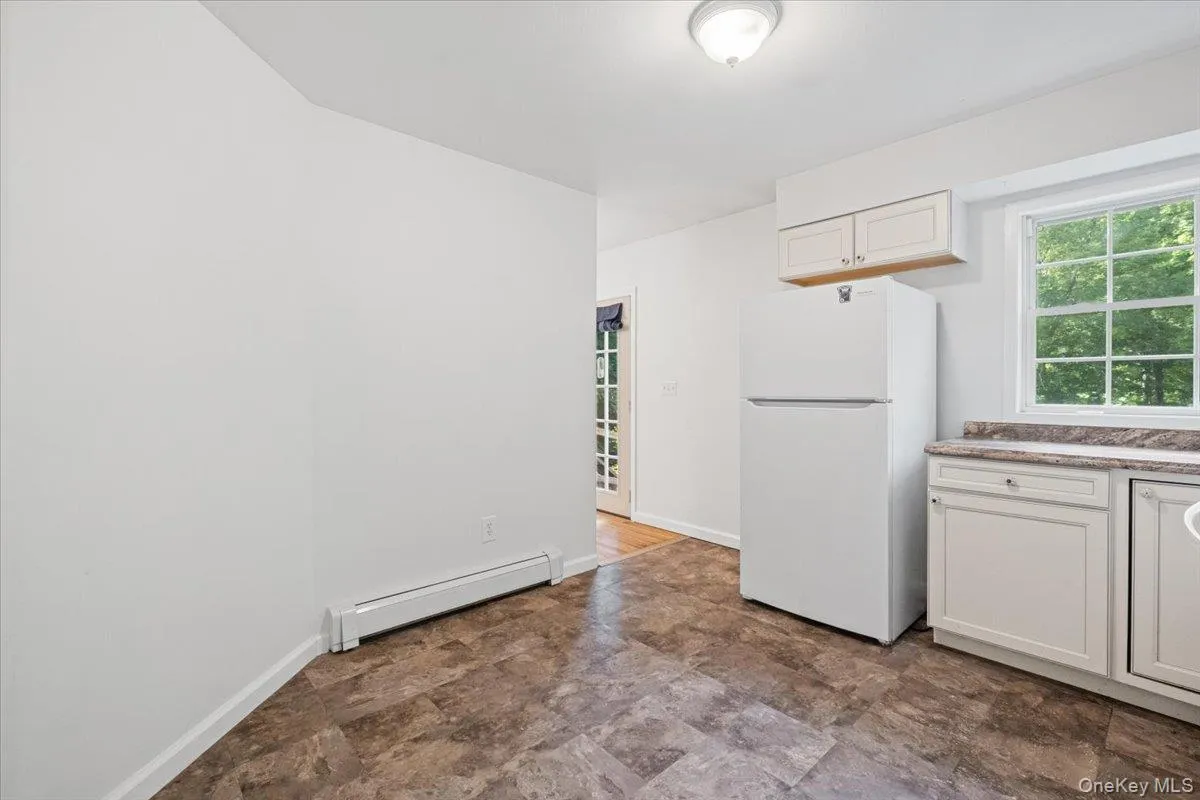 Kitchen leads into the dining and living rooms. Kitchen leads into the dining and living rooms.
