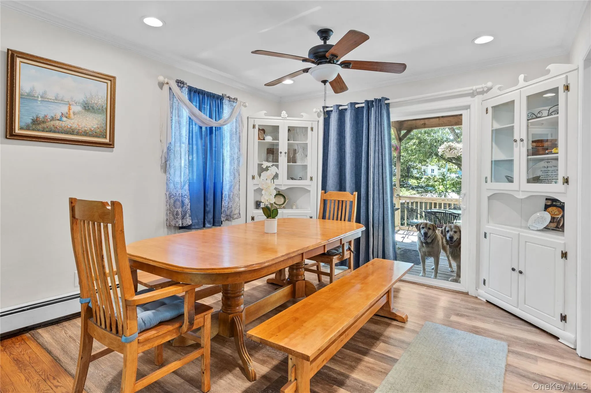 Dining area featuring wood-finish flooring, recessed lighting, and a ceiling fan Dining area featuring wood-finish flooring, recessed lighting, and a ceiling fan
