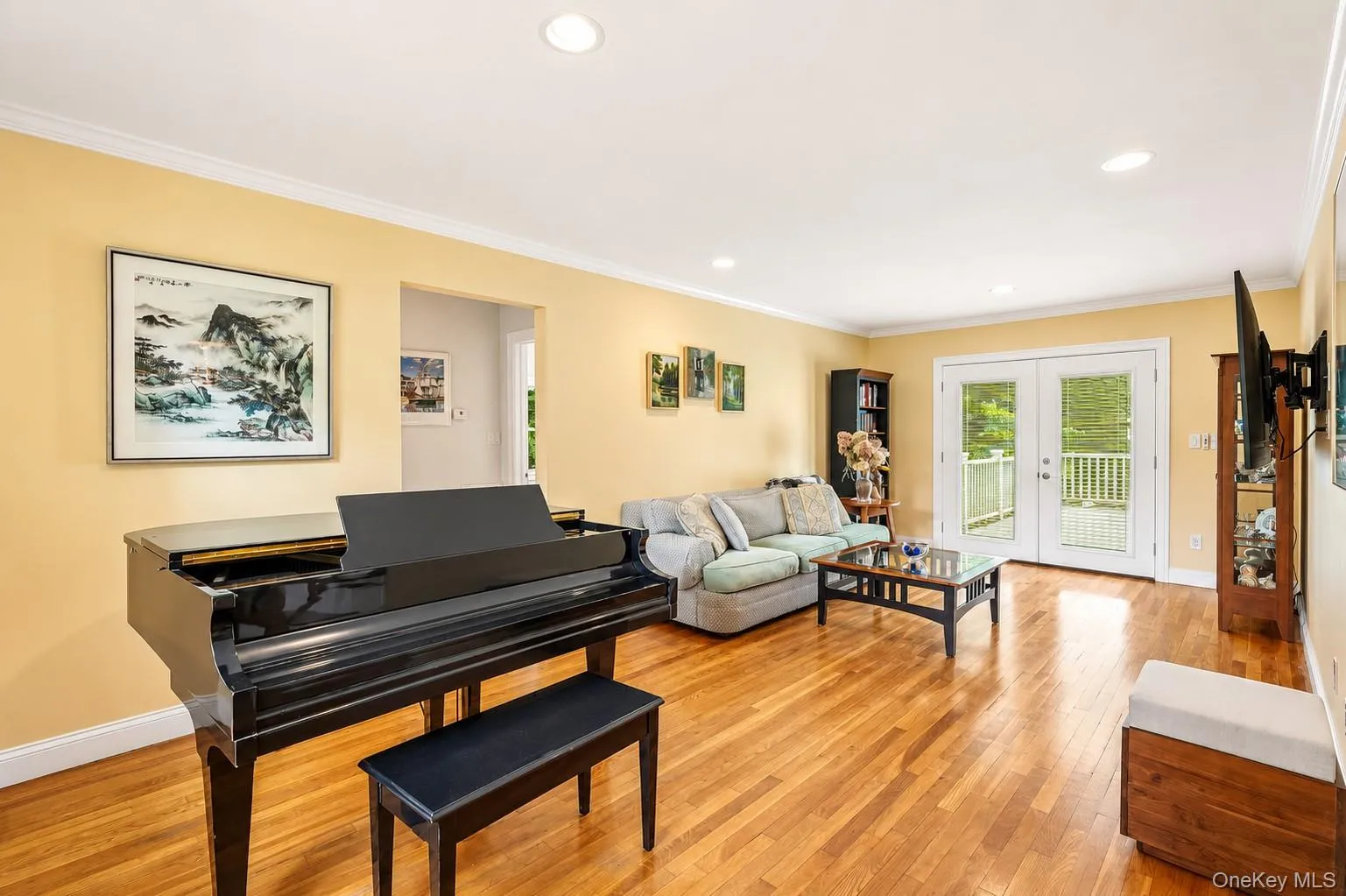 Crown molding, recessed lighting, sliding glass doors leading to Trex deck Crown molding, recessed lighting, sliding glass doors leading to Trex deck