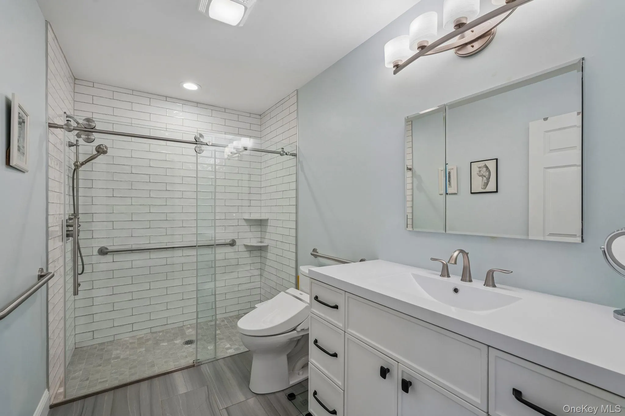 Quartz vanity, oversized walk-in shower, Toto toilet Quartz vanity, oversized walk-in shower, Toto toilet
