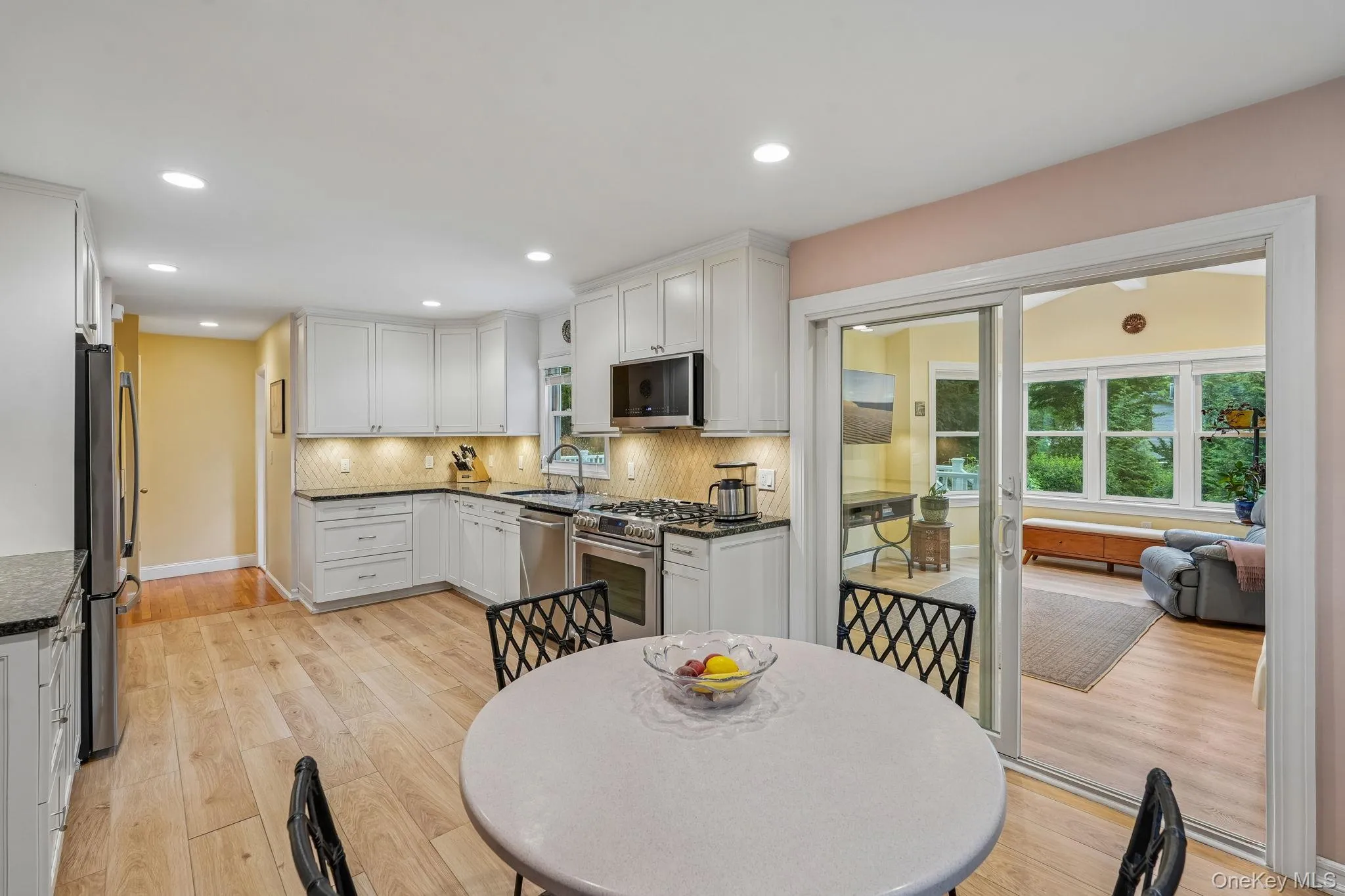 Totally renovated in 2016, features include, granite counters and stainless steel appliances, a casual dining area and access to the family room Totally renovated in 2016, features include, granite counters and stainless steel appliances, a casual dining area and access to the family room