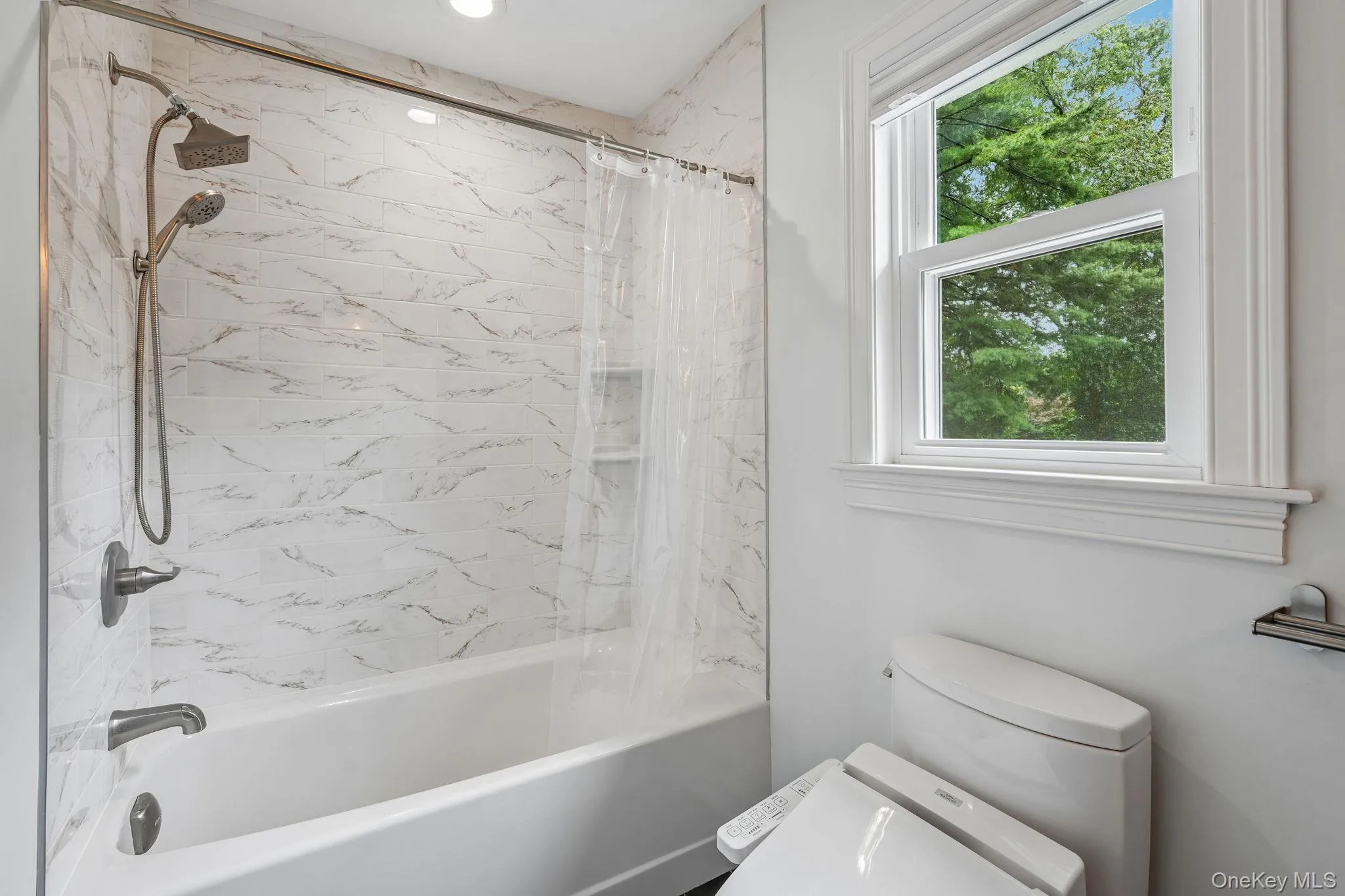 Alternative view of hallway bath with tub/shower combo, Toto toilet Alternative view of hallway bath with tub/shower combo, Toto toilet