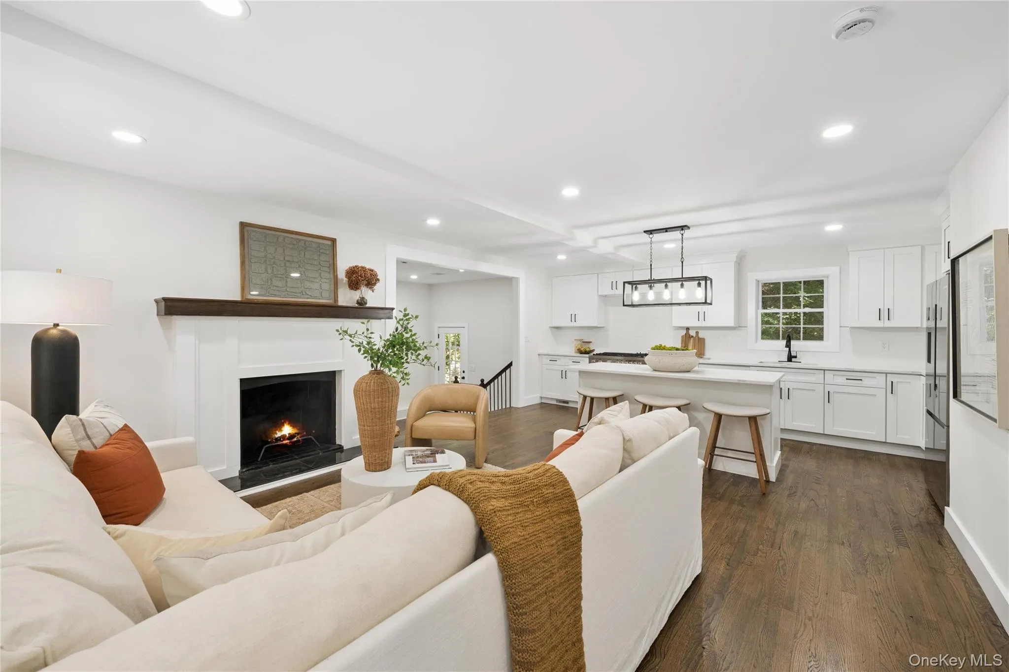 living room, over looks kitchen, w/ wood burning fireplace living room, over looks kitchen, w/ wood burning fireplace