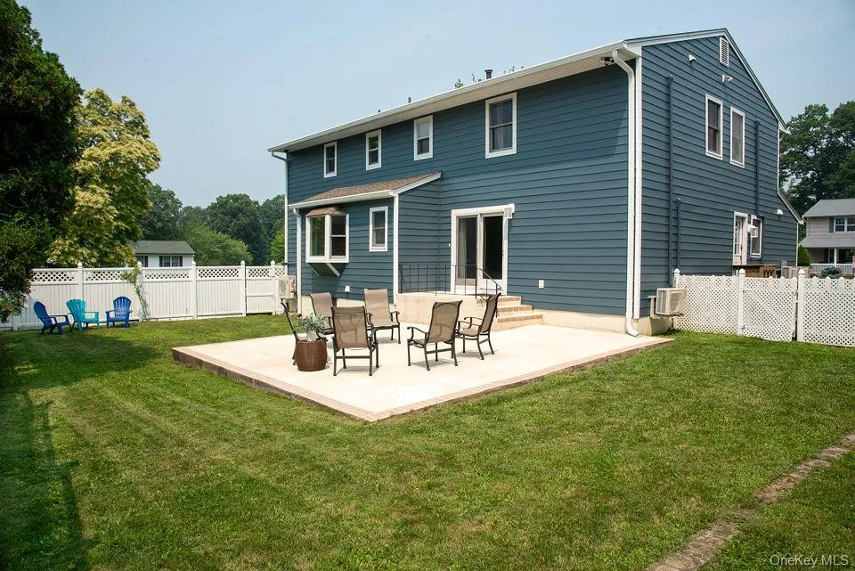 Fenced in backyard with large patio and grass for play and relaxation. Fenced in backyard with large patio and grass for play and relaxation.