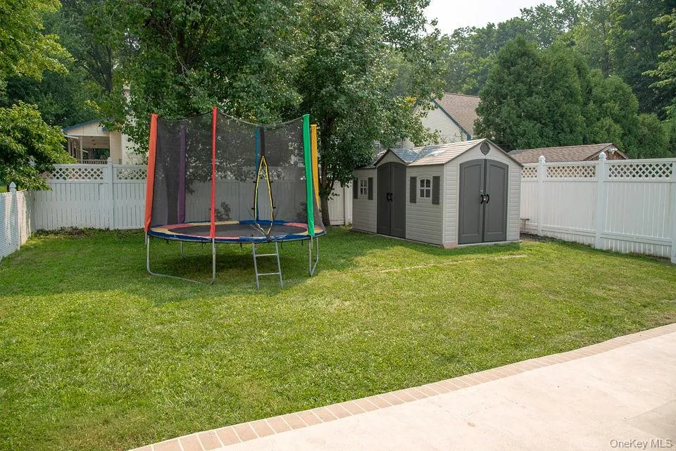 Fenced in backyard with shed. Fenced in backyard with shed.