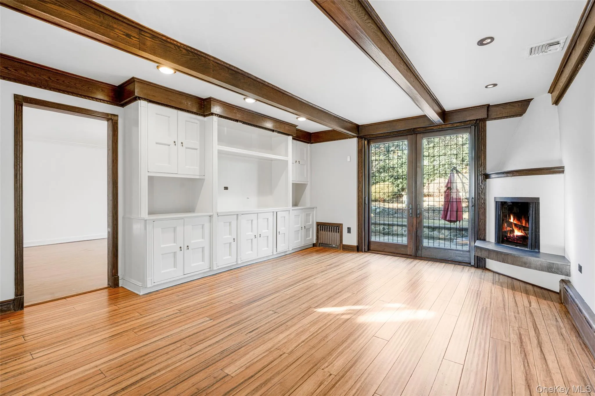Family room with fireplace. French doors to large patio and backyard. Family room with fireplace. French doors to large patio and backyard.