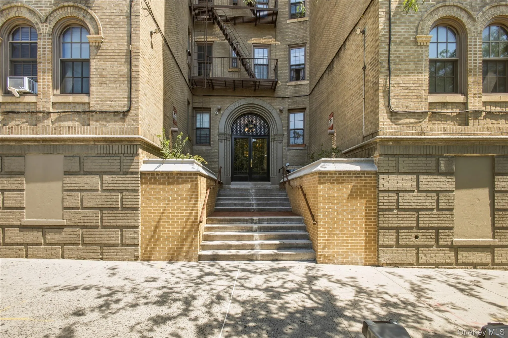 Brick exterior facade featuring arched windows Brick exterior facade featuring arched windows