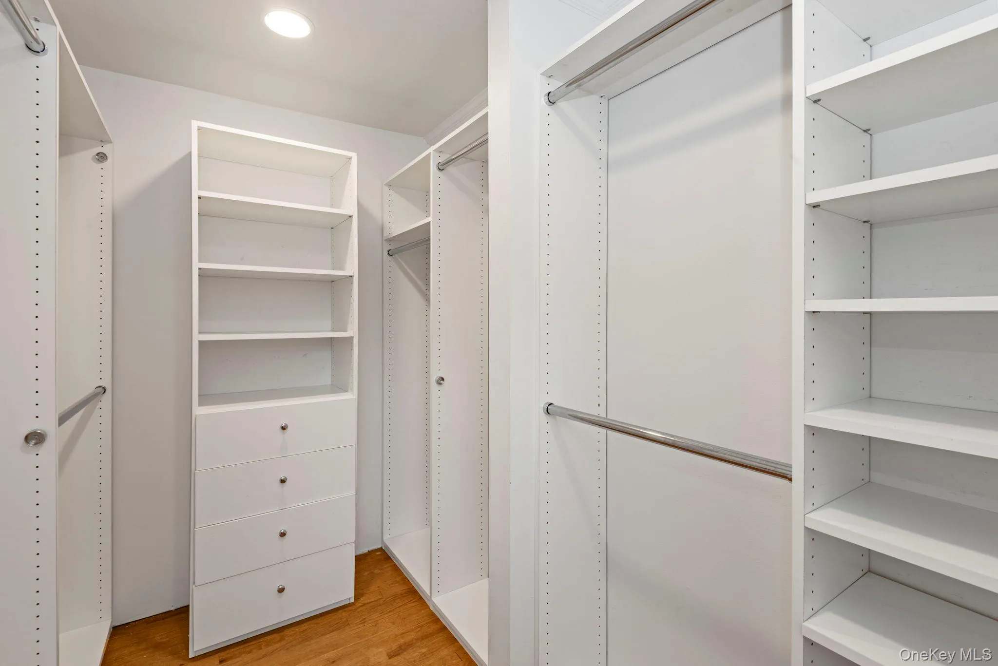 Primary walk-in closet Primary walk-in closet