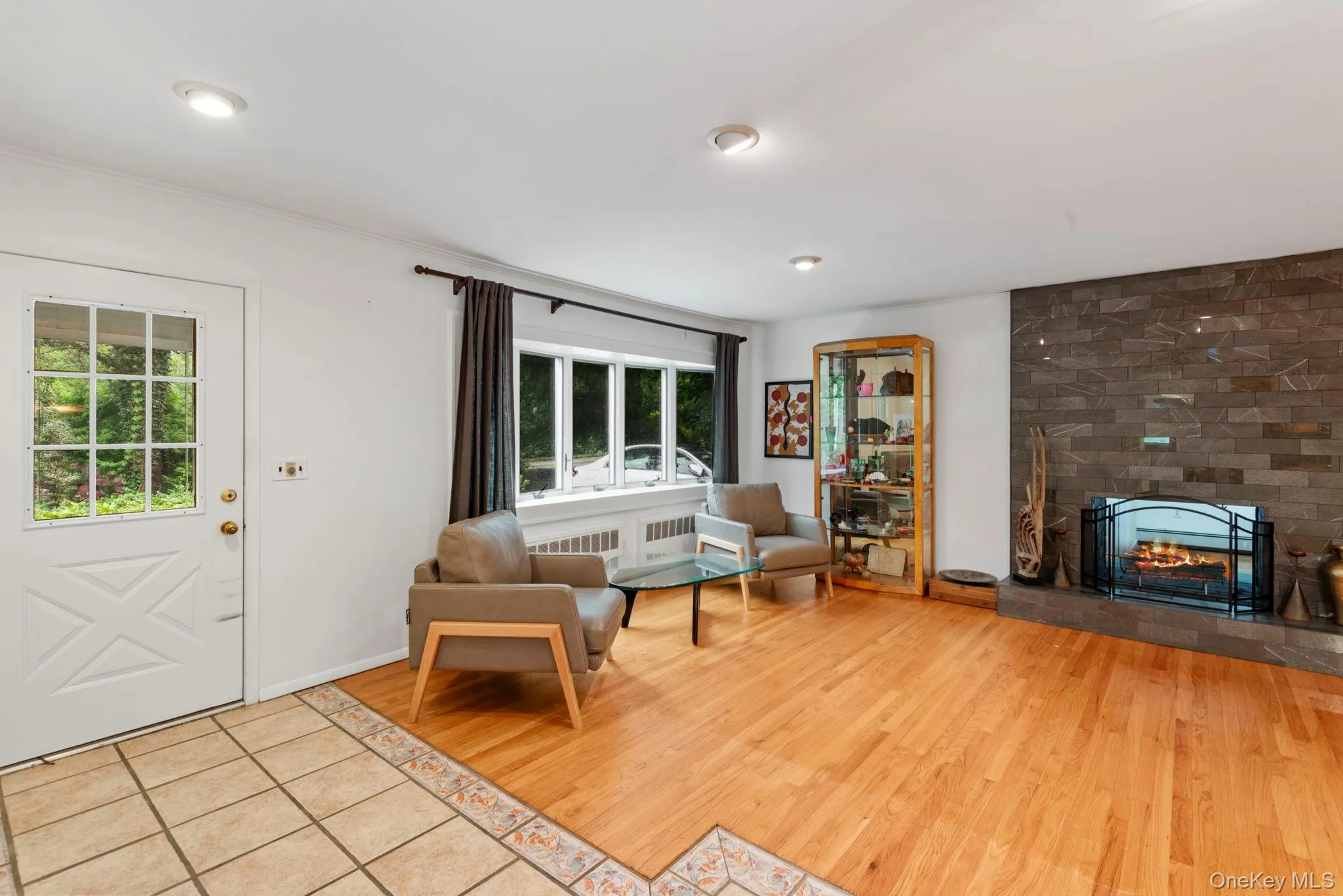 Enter into your open floorplan living with cozy fireplace Enter into your open floorplan living with cozy fireplace