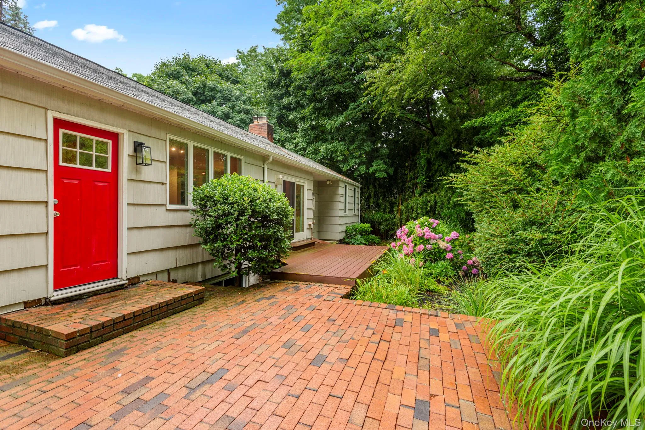 Beautiful patio and newer composite deck off back door and kitchen Beautiful patio and newer composite deck off back door and kitchen