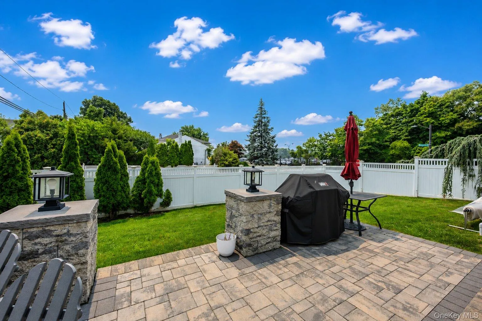 Fully fenced backyard. Paver Patio with grass area and backyard gate to side-road. Fully fenced backyard. Paver Patio with grass area and backyard gate to side-road.