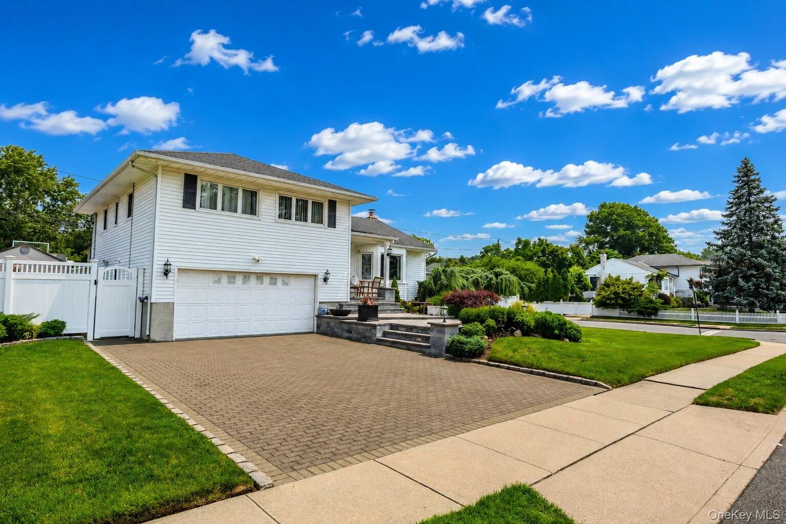 Beautiful private large corner lot. Large widened paver driveway. Sky has been edited. Beautiful private large corner lot. Large widened paver driveway. Sky has been edited.