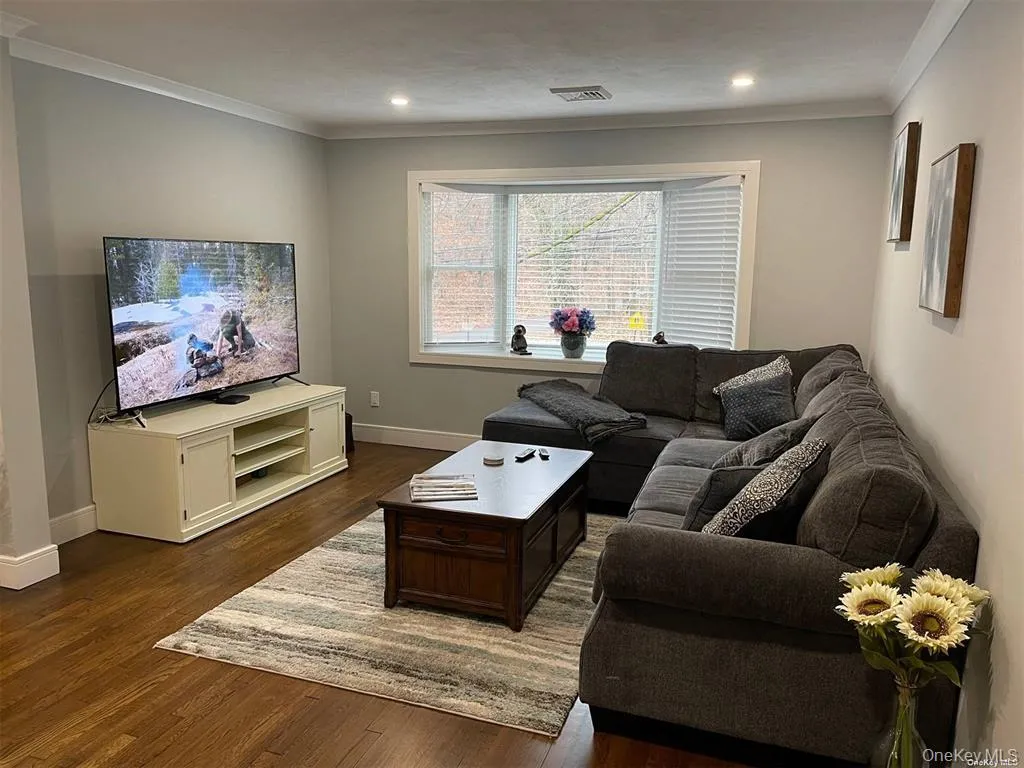 Living Room with Sectional Couch Coffee Table, Console Table and TV Living Room with Sectional Couch Coffee Table, Console Table and TV