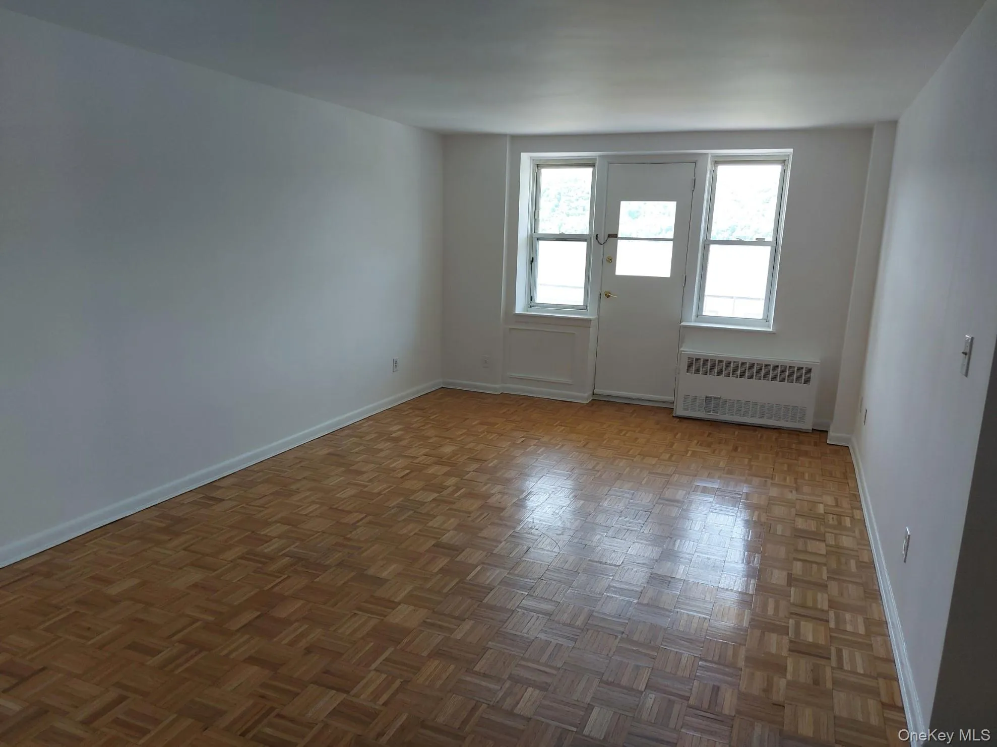 featuring parquet floors & door to balcony featuring parquet floors & door to balcony