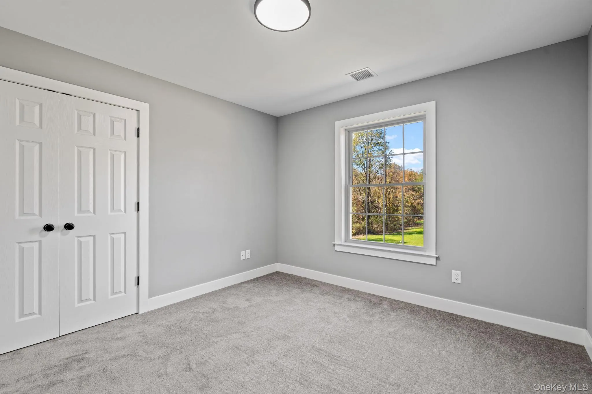 Unfurnished bedroom featuring a closet, visible vents, baseboards, and carpet floors Unfurnished bedroom featuring a closet, visible vents, baseboards, and carpet floors