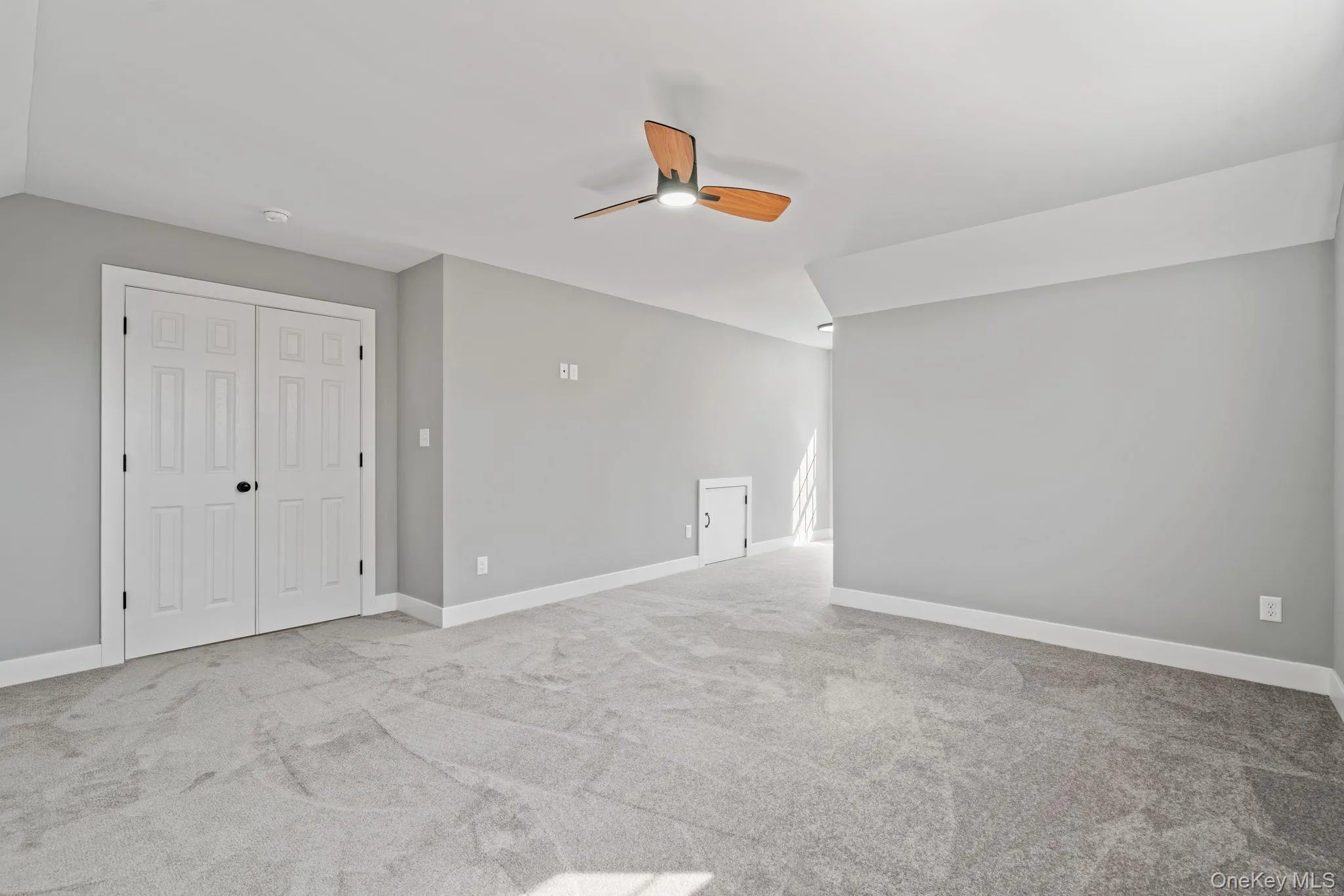 Bonus room with ceiling fan, baseboards, carpet flooring, and vaulted ceiling Bonus room with ceiling fan, baseboards, carpet flooring, and vaulted ceiling