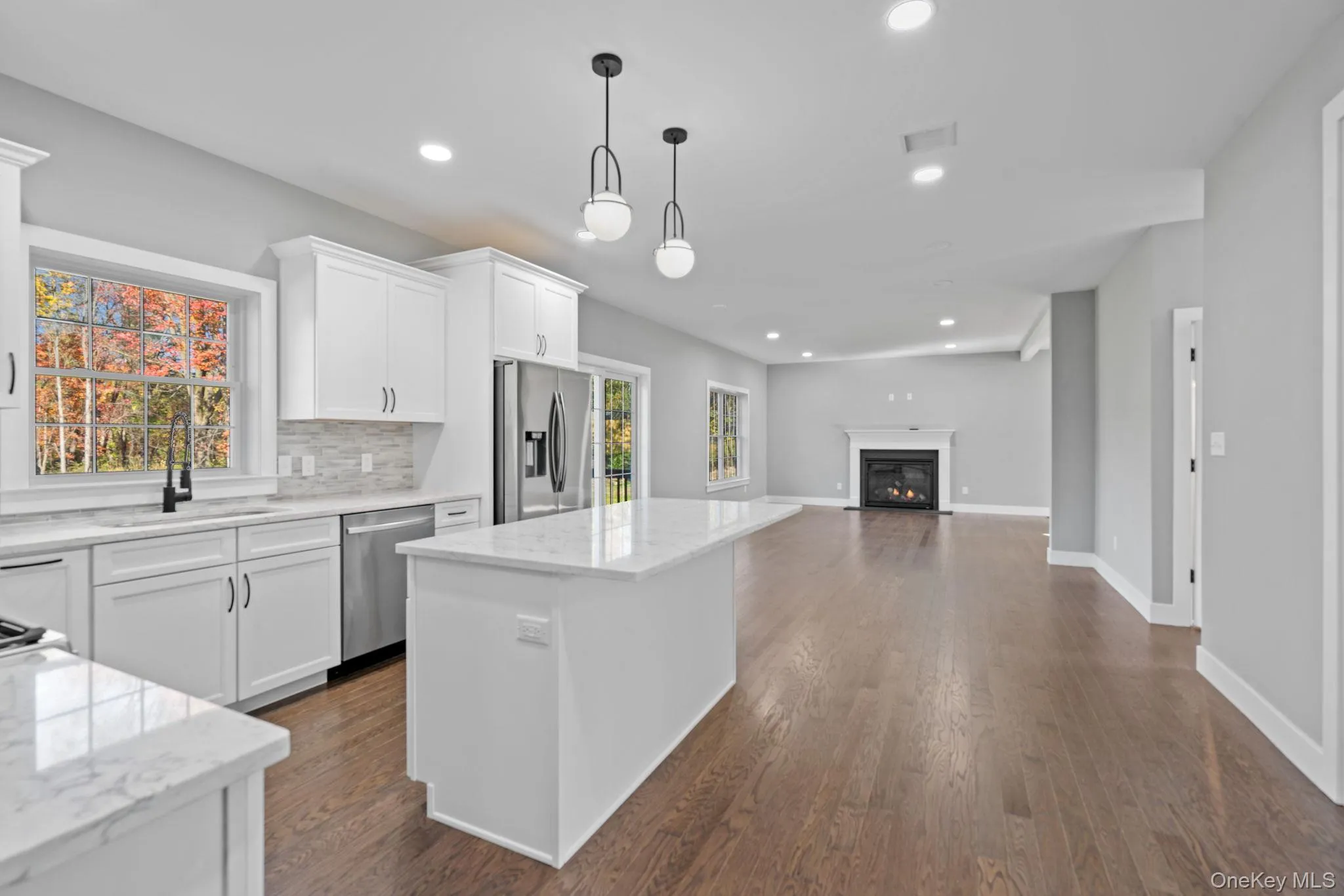 Kitchen featuring visible vents, a sink, appliances with stainless steel finishes, recessed lighting, and a kitchen island Kitchen featuring visible vents, a sink, appliances with stainless steel finishes, recessed lighting, and a kitchen island