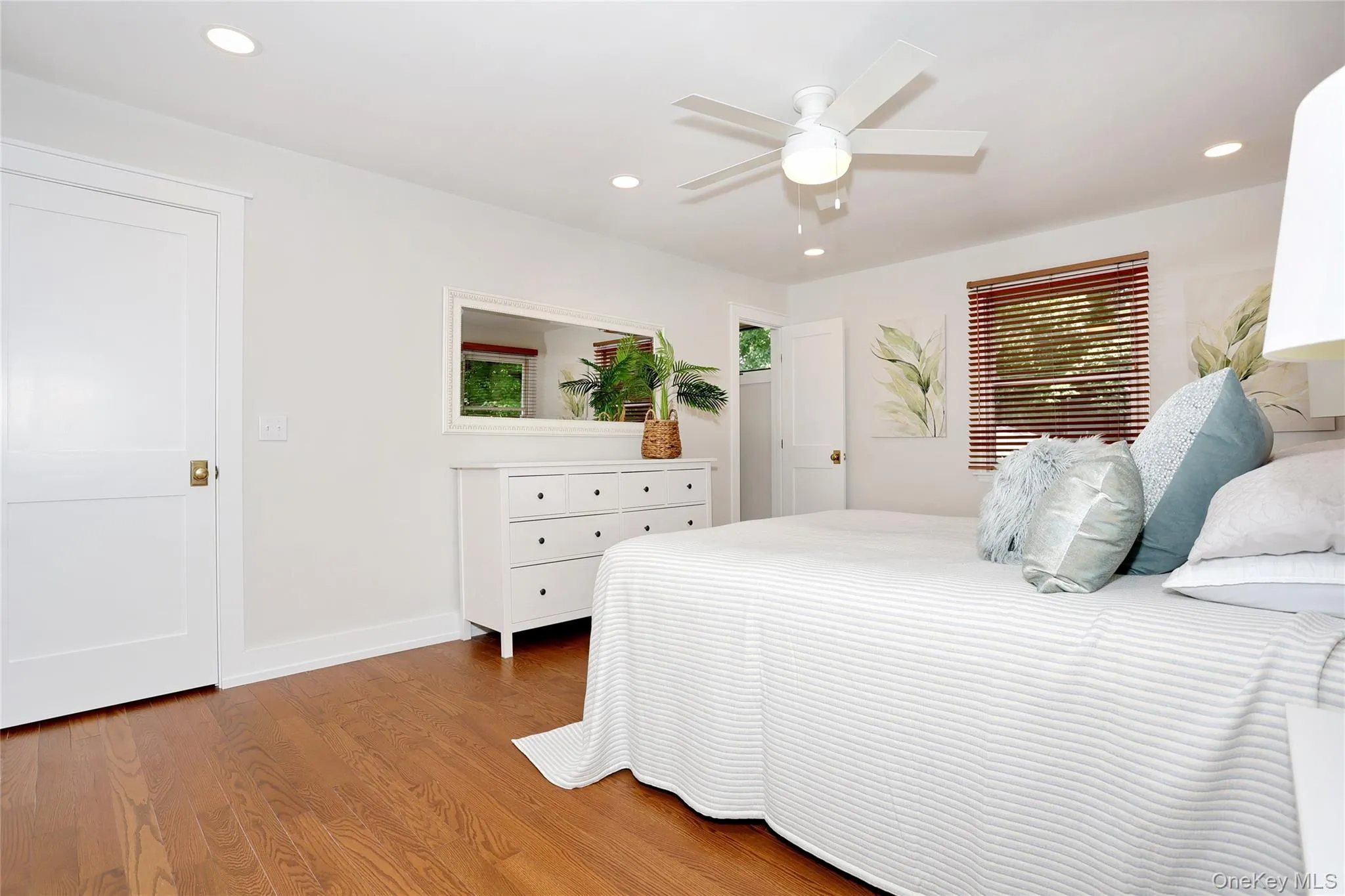 Primary en suite Bedroom with all new hardwood floors. Primary en suite Bedroom with all new hardwood floors.