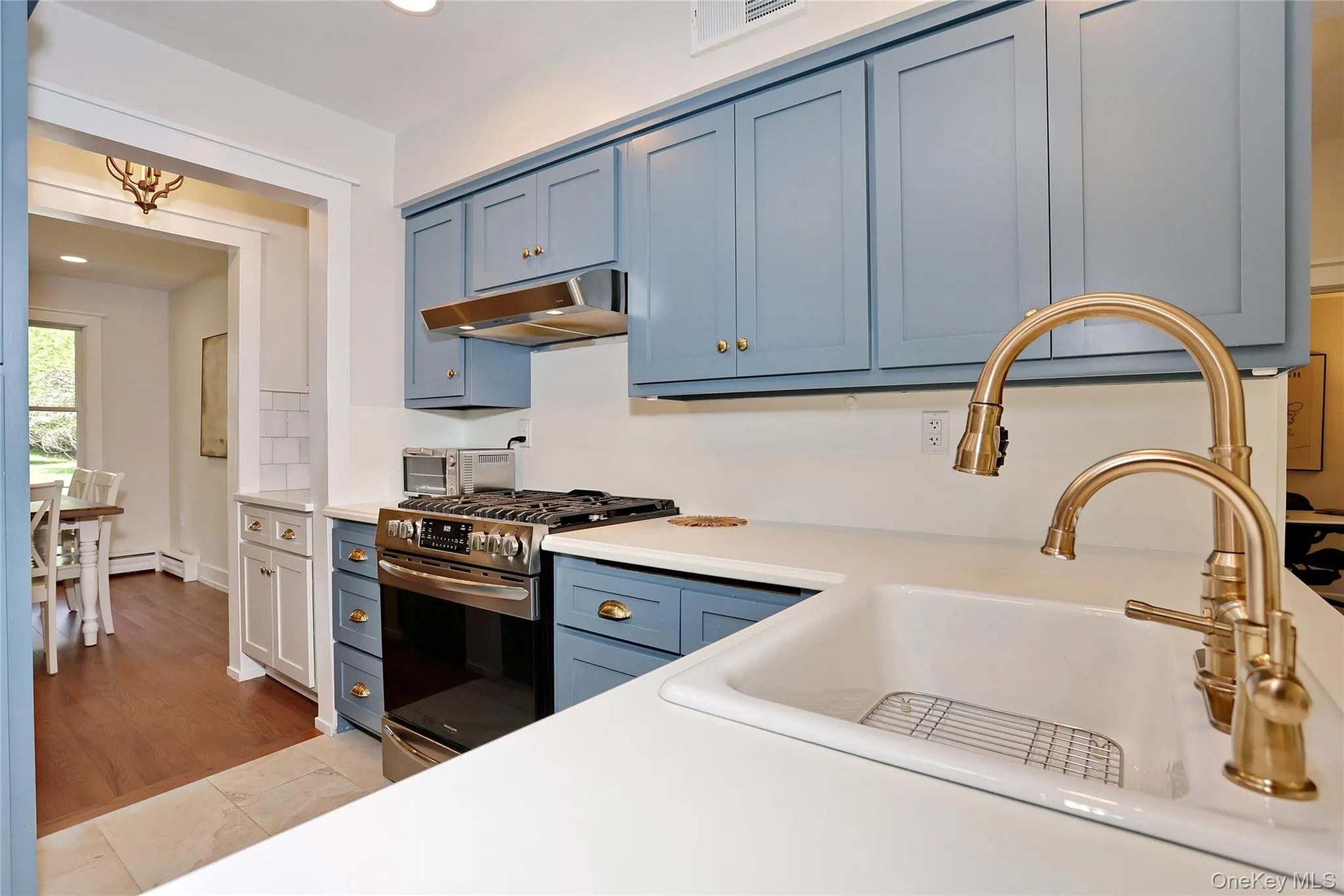 Five-burner gas range, brass hardware and fittings. Five-burner gas range, brass hardware and fittings.