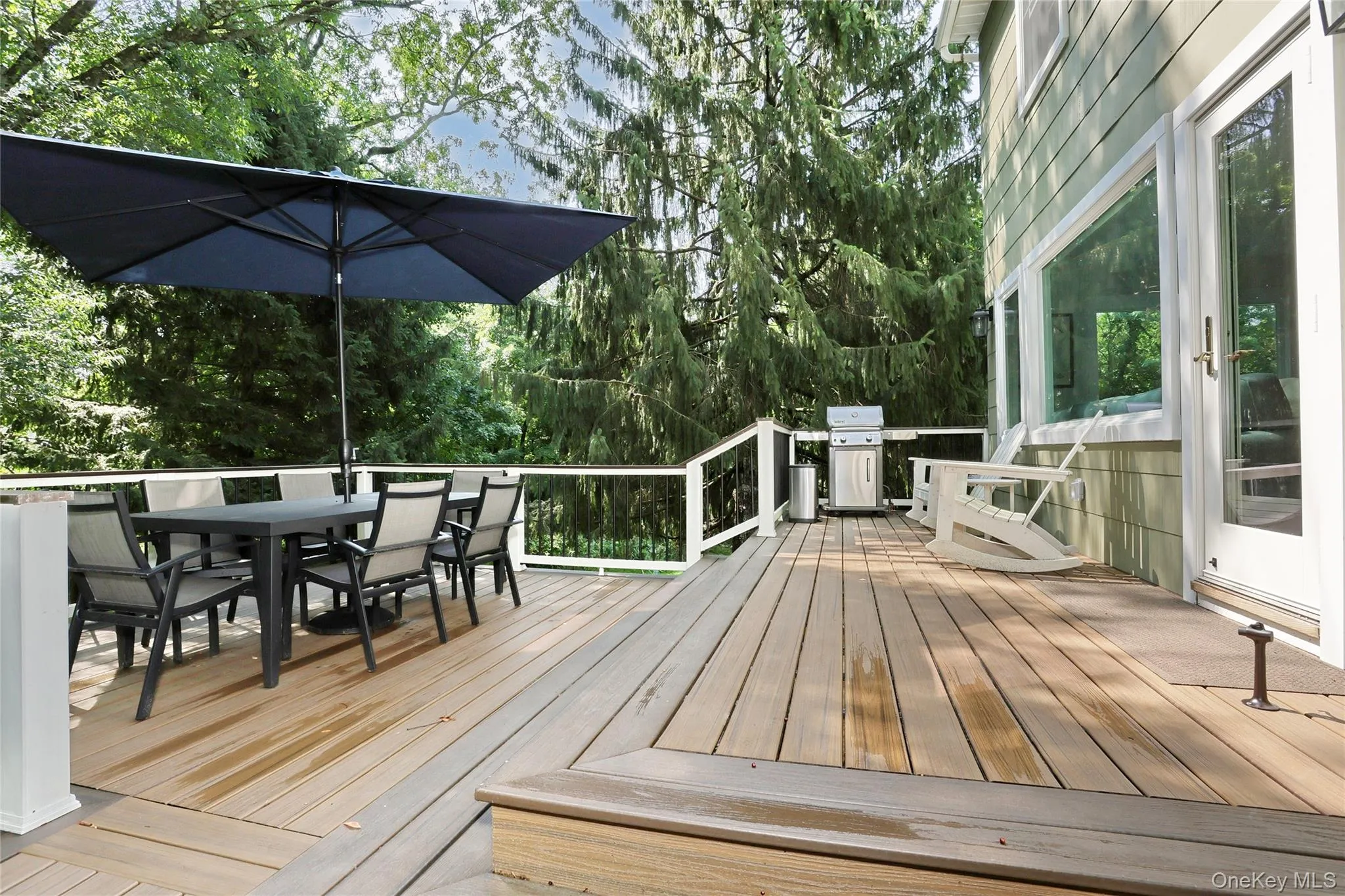Tiered trex deck offers a perfect spot for outdoor dining. Tiered trex deck offers a perfect spot for outdoor dining.
