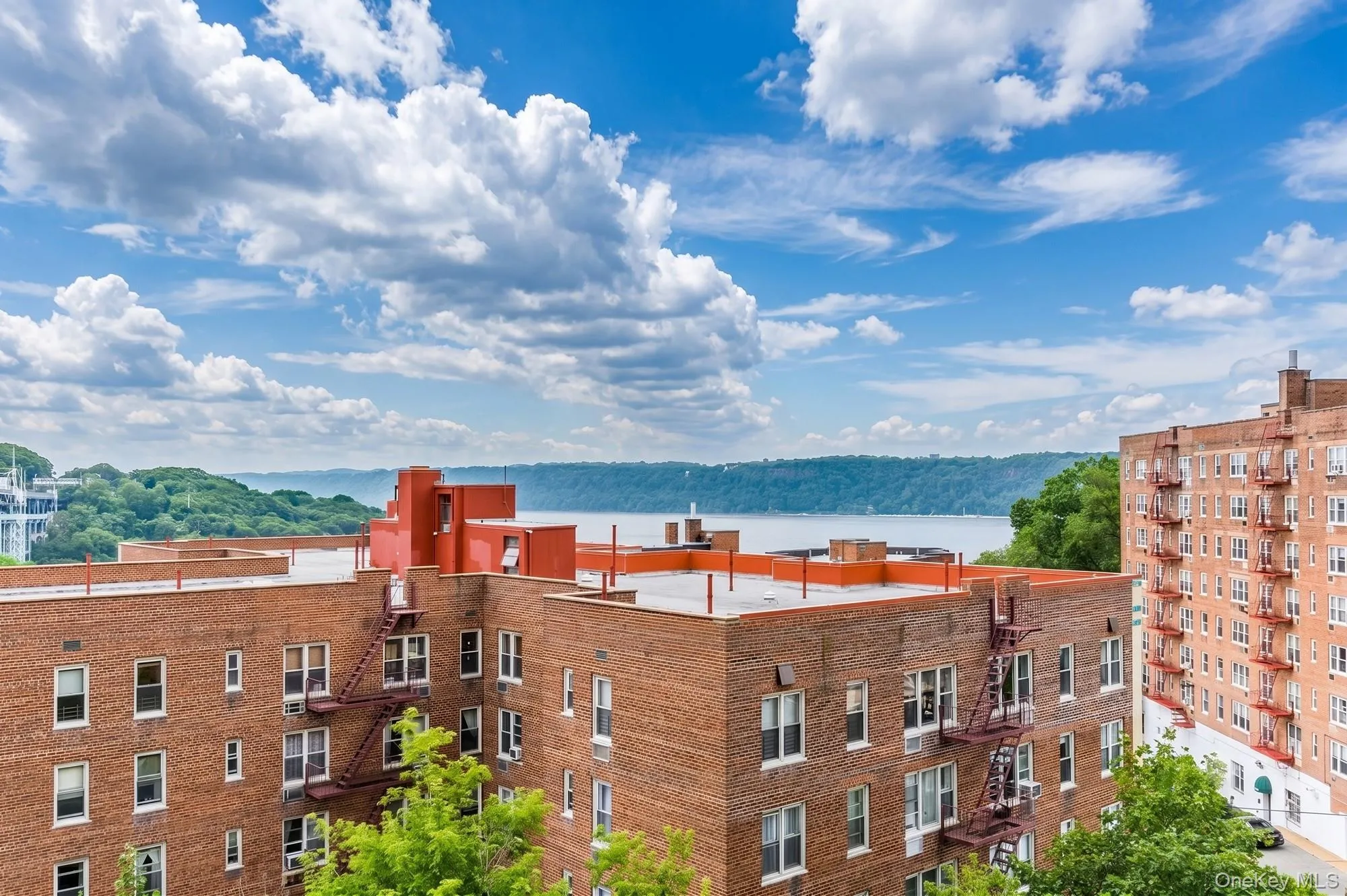 Beautiful view with Hudson River visible over the roof tops. Beautiful view with Hudson River visible over the roof tops.