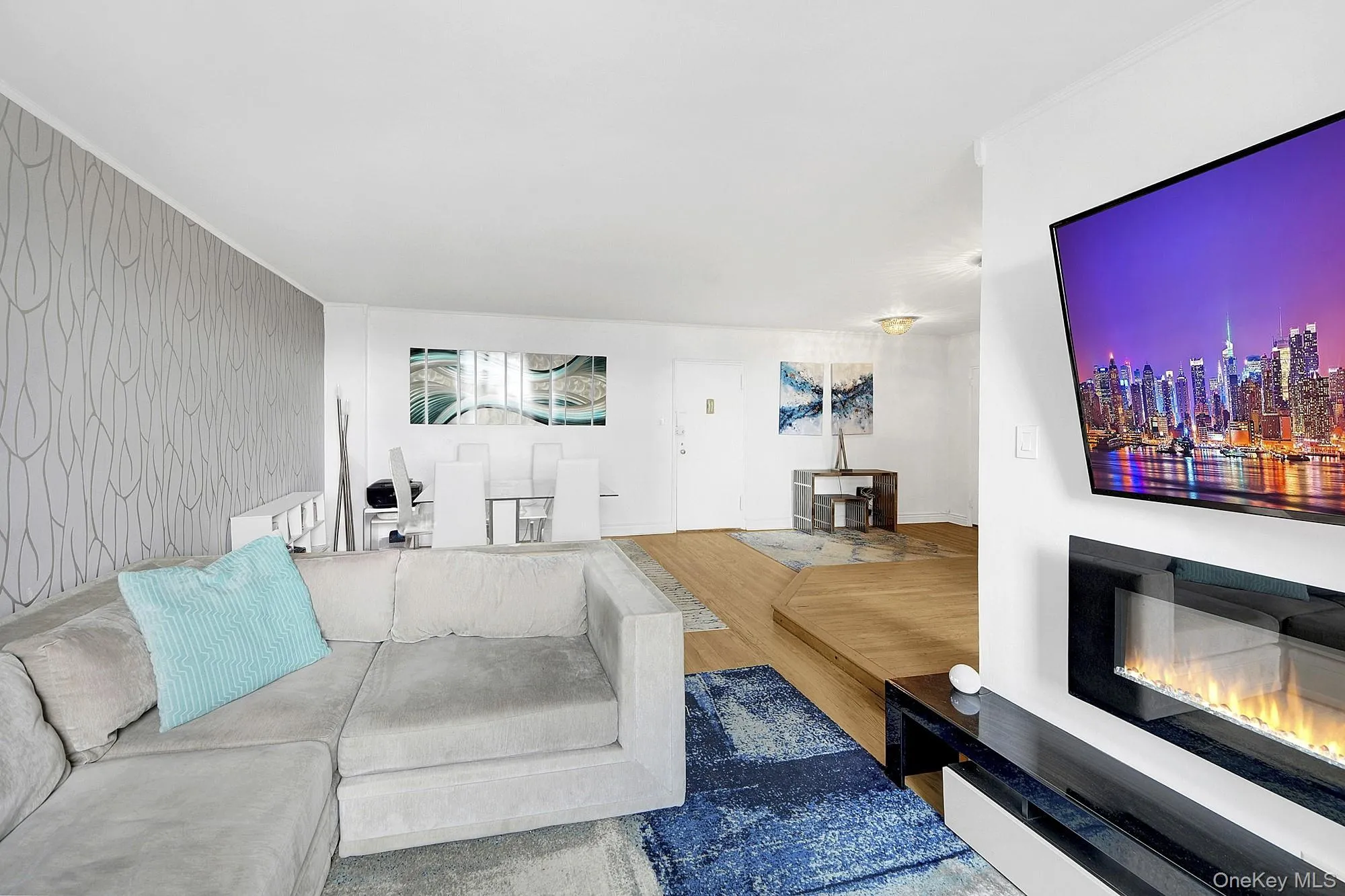 Large living room with double windows and hardwood floors. Large living room with double windows and hardwood floors.
