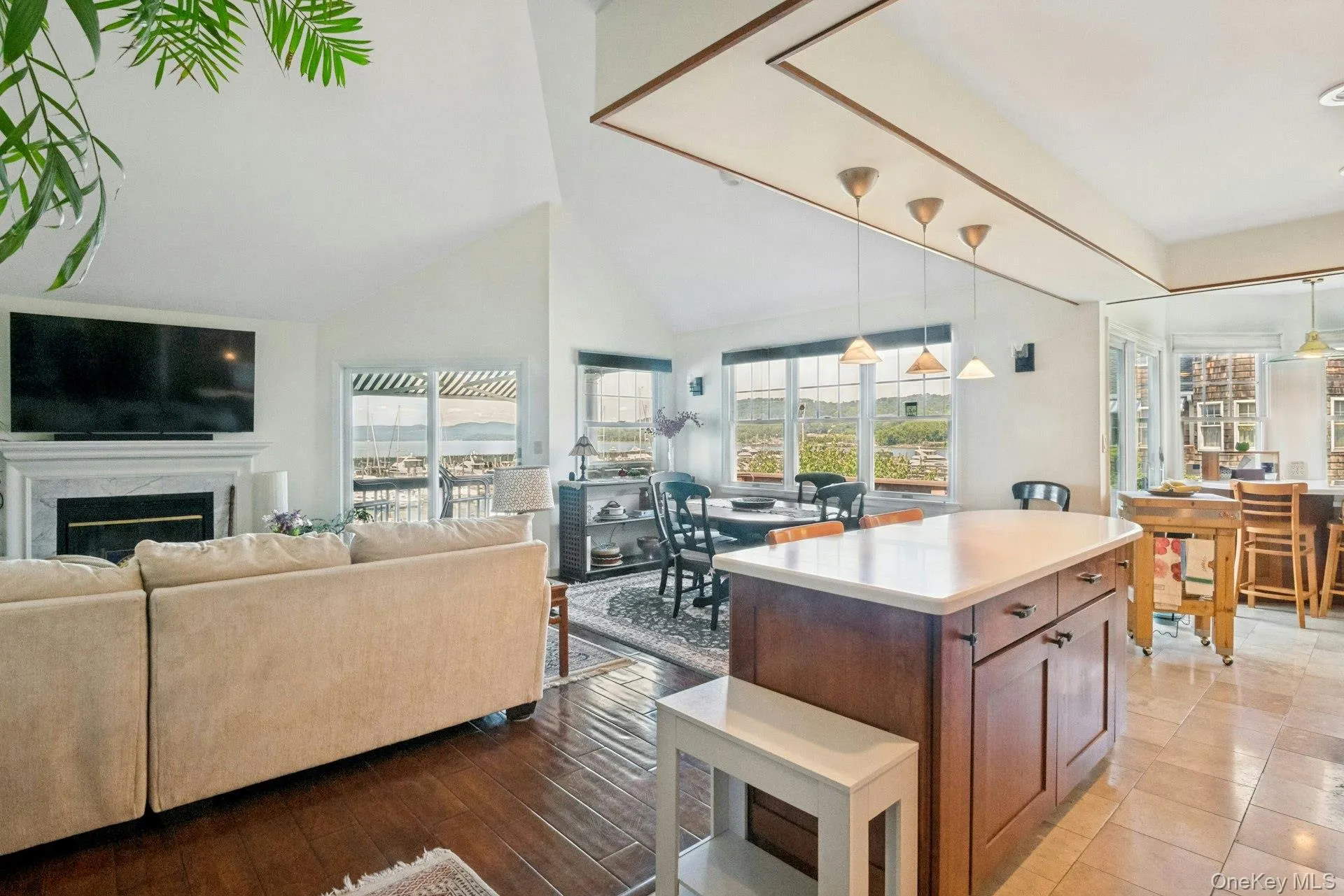Open floor plan with 2 sliding doors to the wrap around deck. Open floor plan with 2 sliding doors to the wrap around deck.