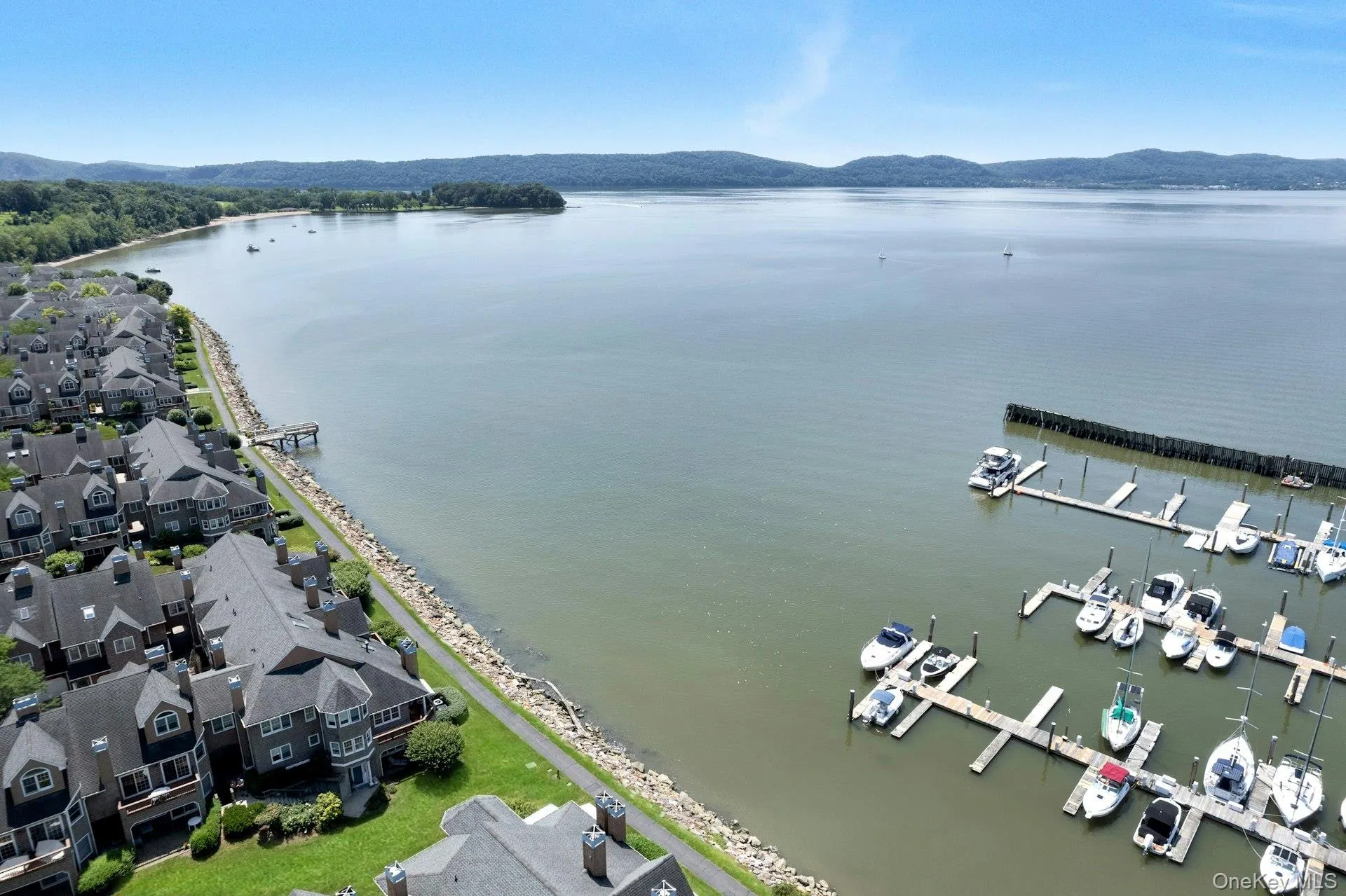 View of the unit perched close to the water and the marina. View of the unit perched close to the water and the marina.
