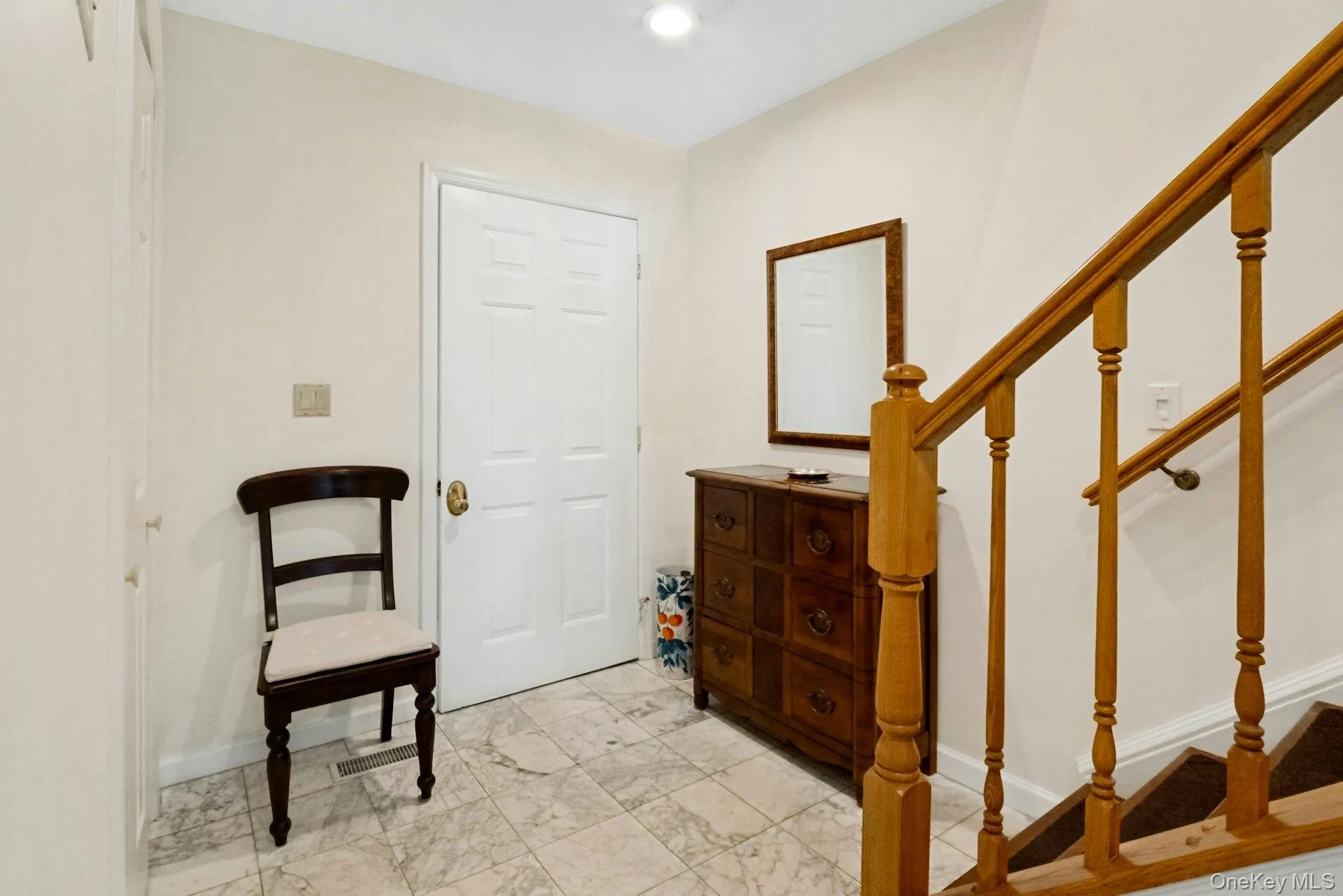Marble floor and coat closet in the entry foyer. Marble floor and coat closet in the entry foyer.