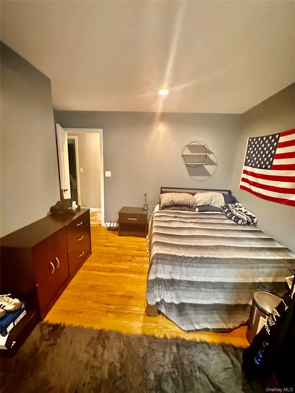 Bedroom 2 featuring wood-finish flooring, recessed lighting, and a neutral wall color Bedroom 2 featuring wood-finish flooring, recessed lighting, and a neutral wall color