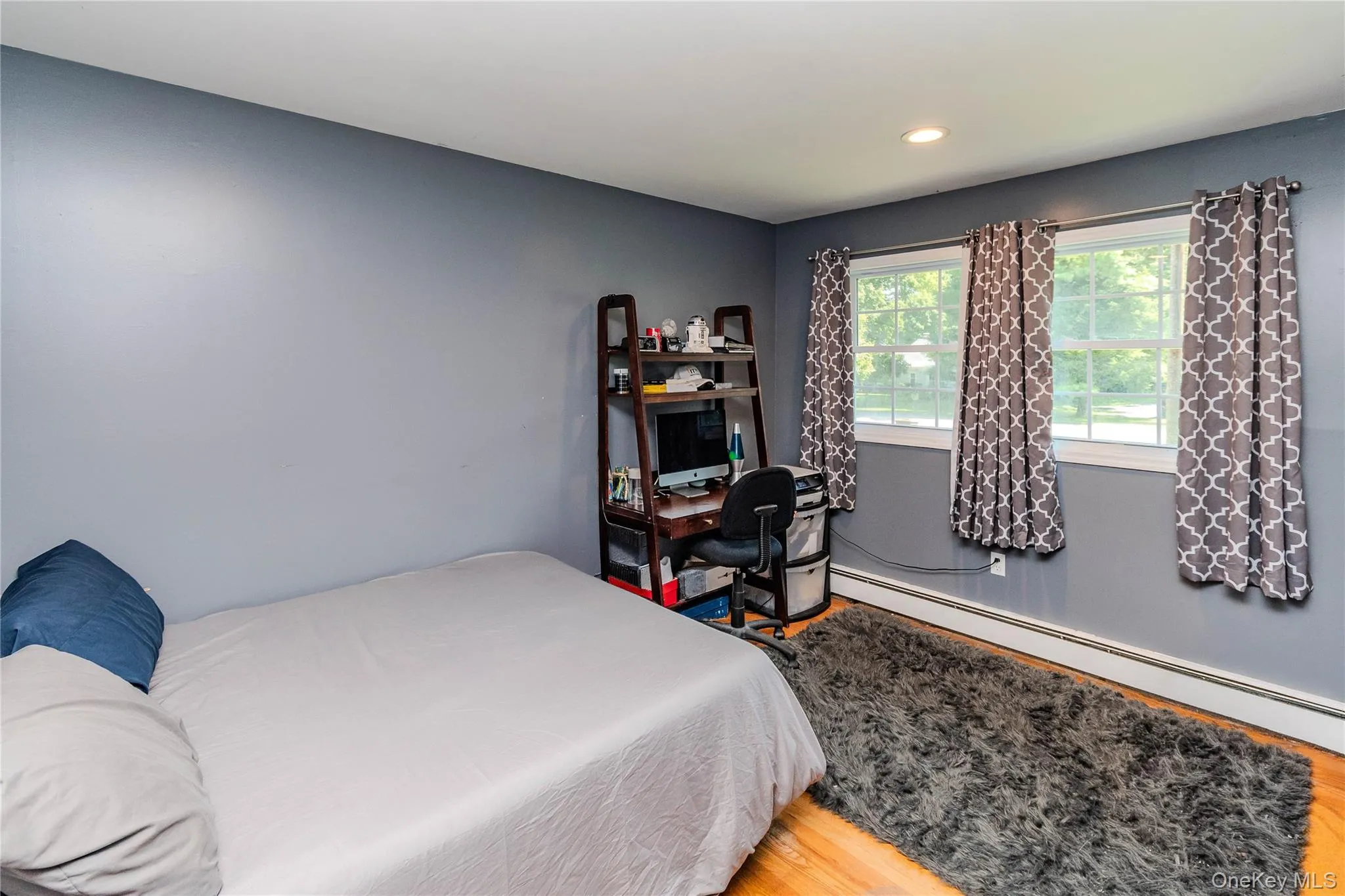 Bedroom 2 Hardwood flooring, painted walls, recessed lighting, and dual windows Bedroom 2 Hardwood flooring, painted walls, recessed lighting, and dual windows