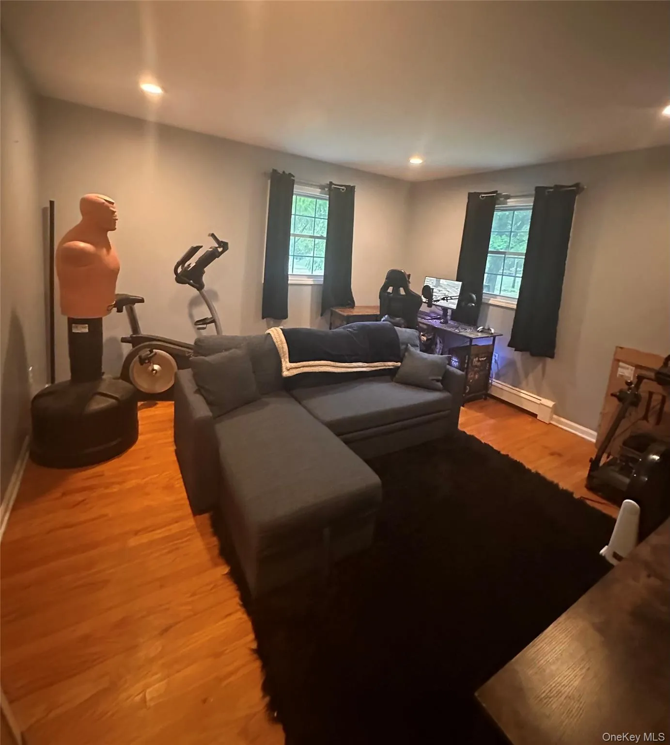 Bedroom 3Spacious corner bedroom featuring hardwood floors. Bedroom 3Spacious corner bedroom featuring hardwood floors.