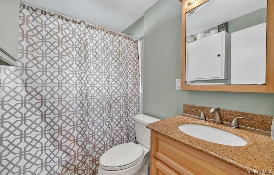 The first level full bath with vanity, and tub/shower The first level full bath with vanity, and tub/shower