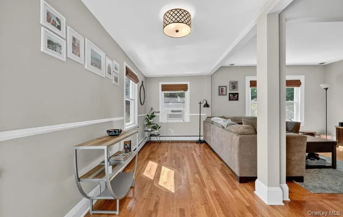 The entry area has a coat closed and full view of the living/dining area to the right The entry area has a coat closed and full view of the living/dining area to the right