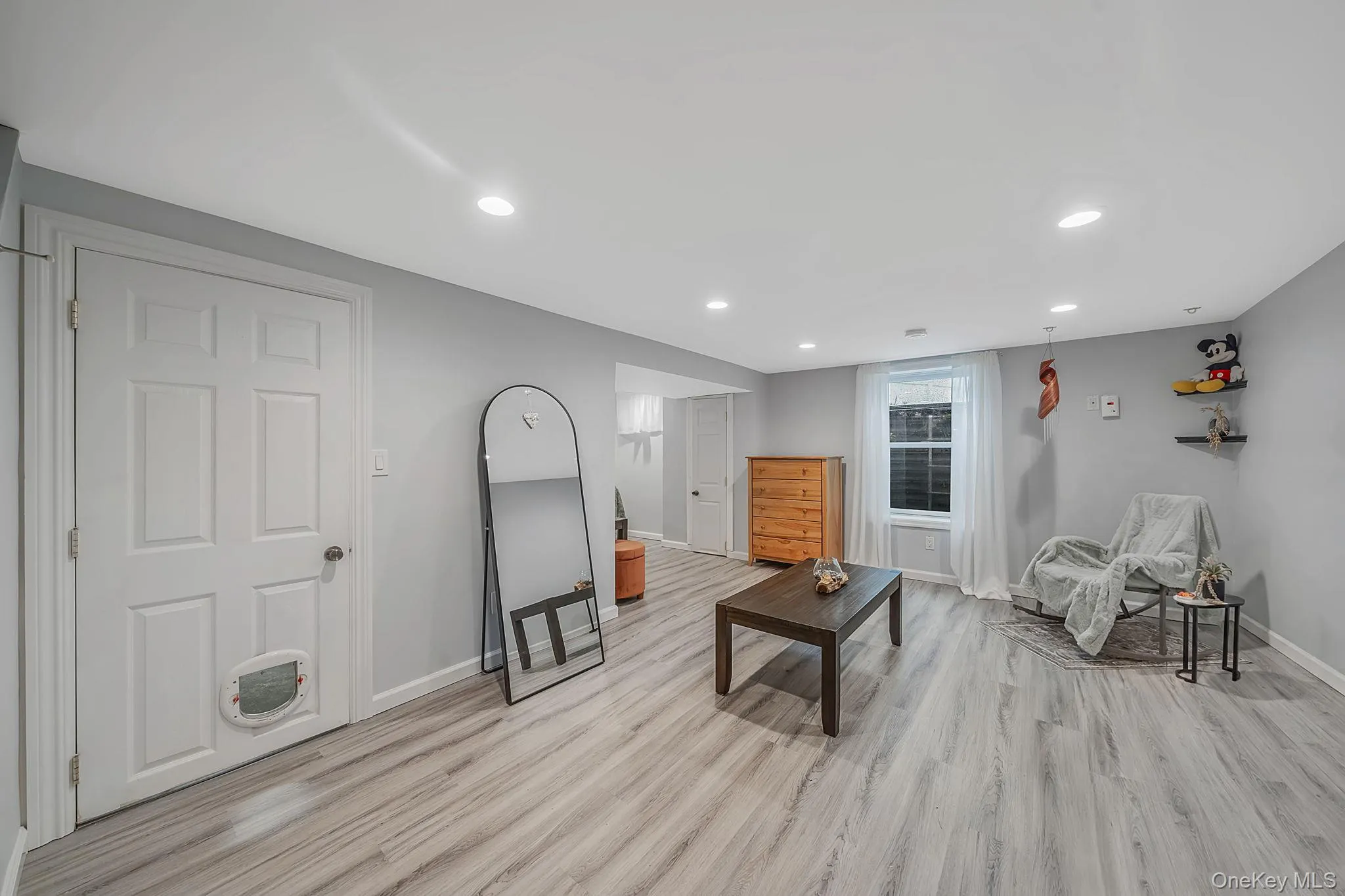 Finished part of basement featuring an egress window Finished part of basement featuring an egress window