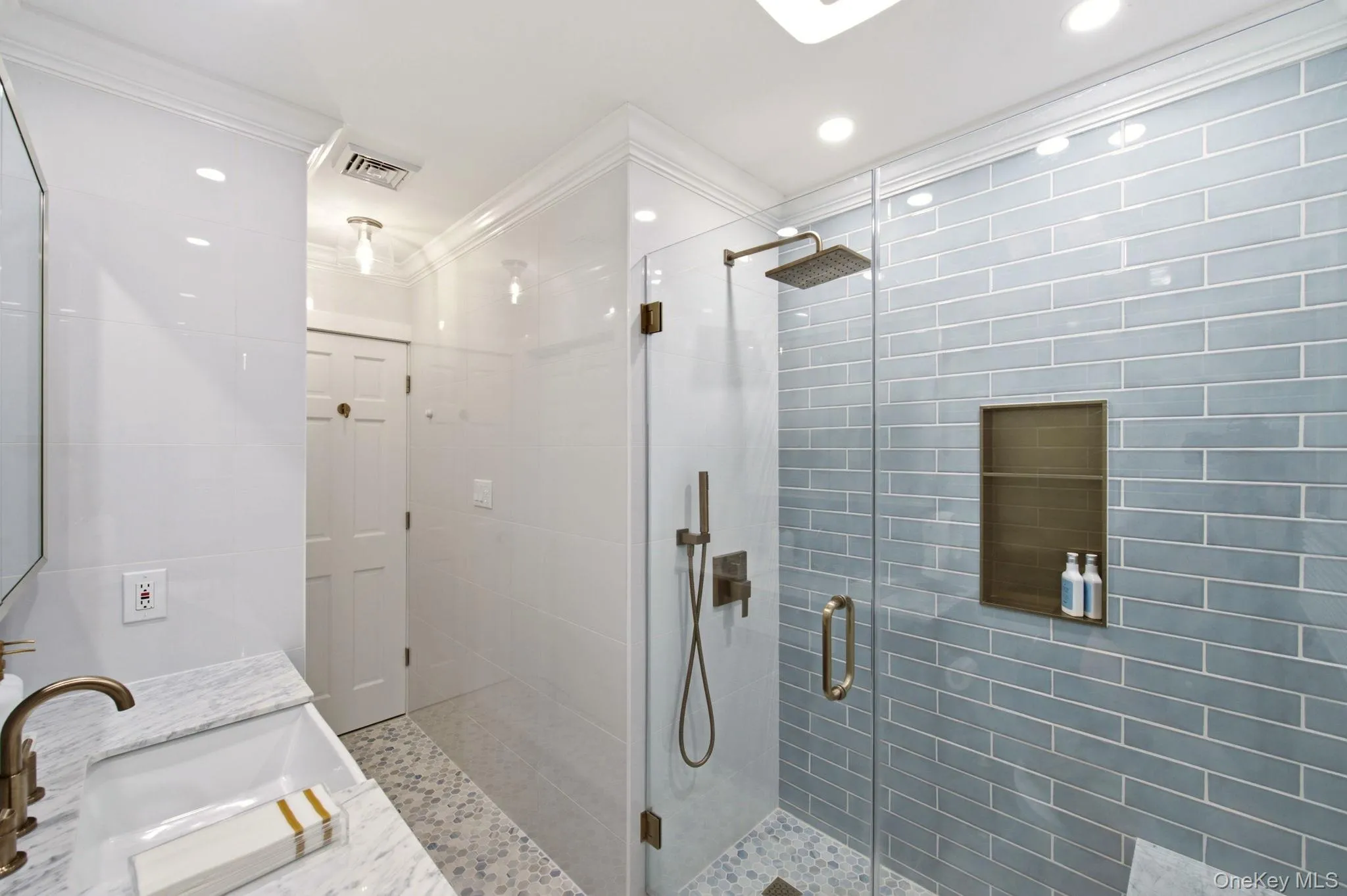 New Tile and Brass Finishes give this Bathroom an Elegant Spa Feel! New Tile and Brass Finishes give this Bathroom an Elegant Spa Feel!